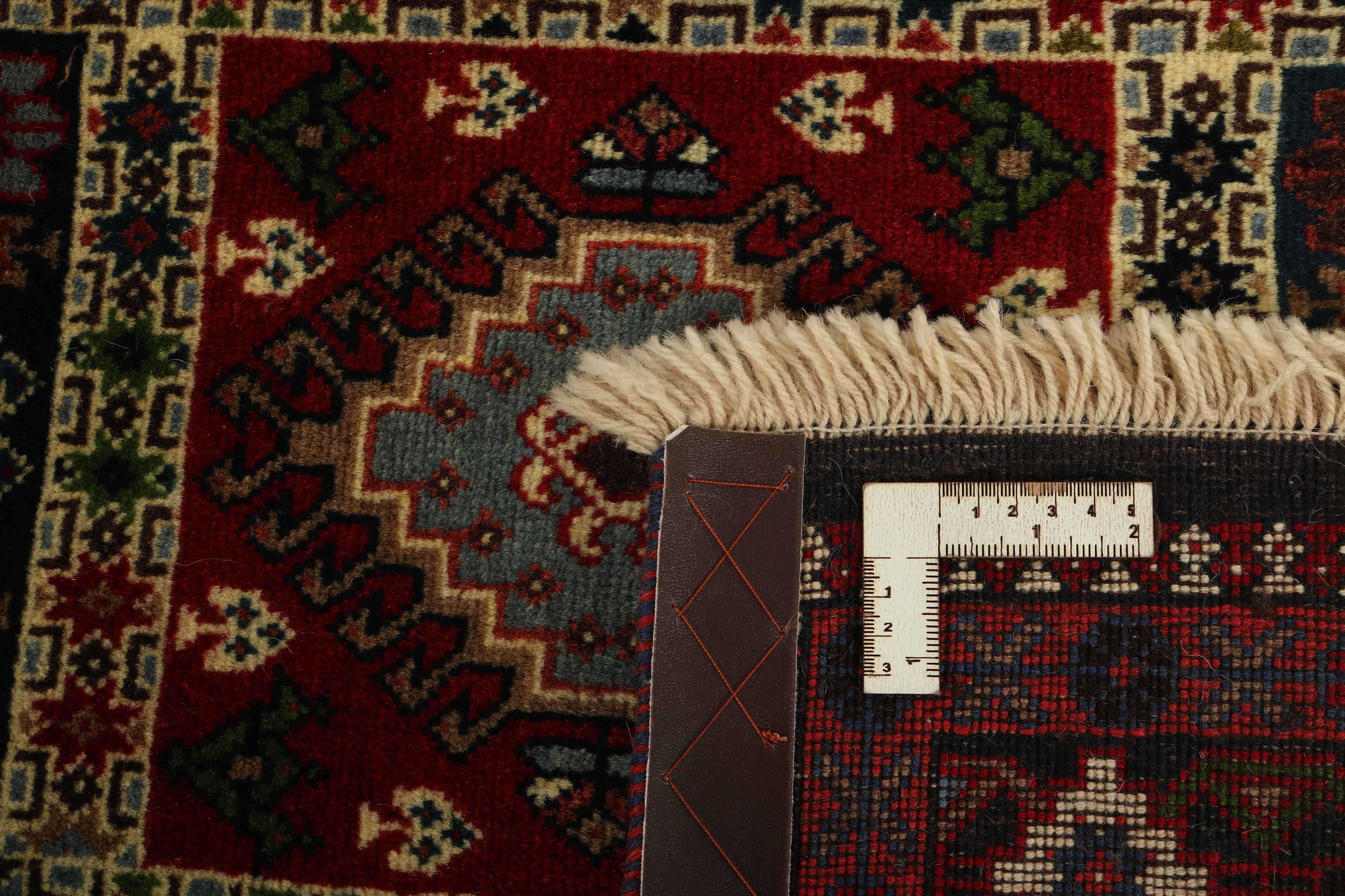 red authentic persian rug with a traditional design