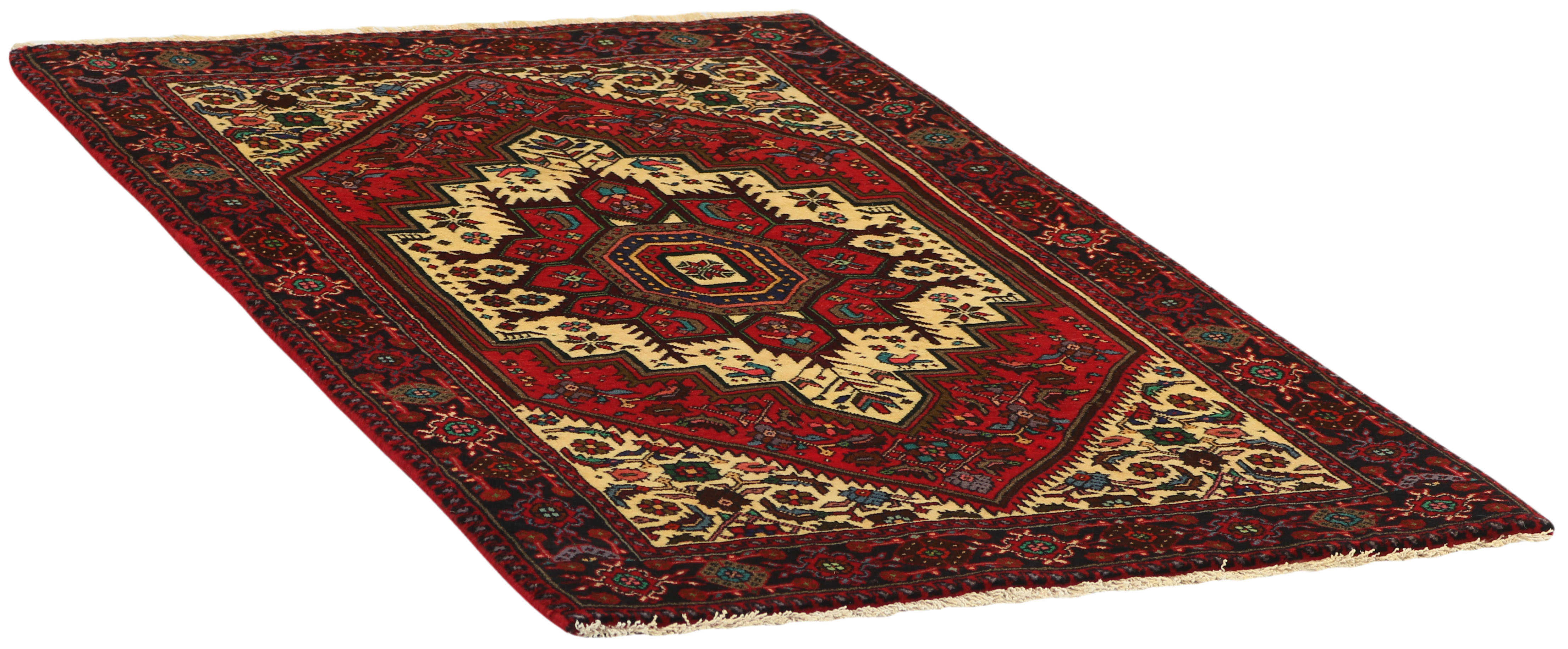 Red and beige persian rug with a floral design