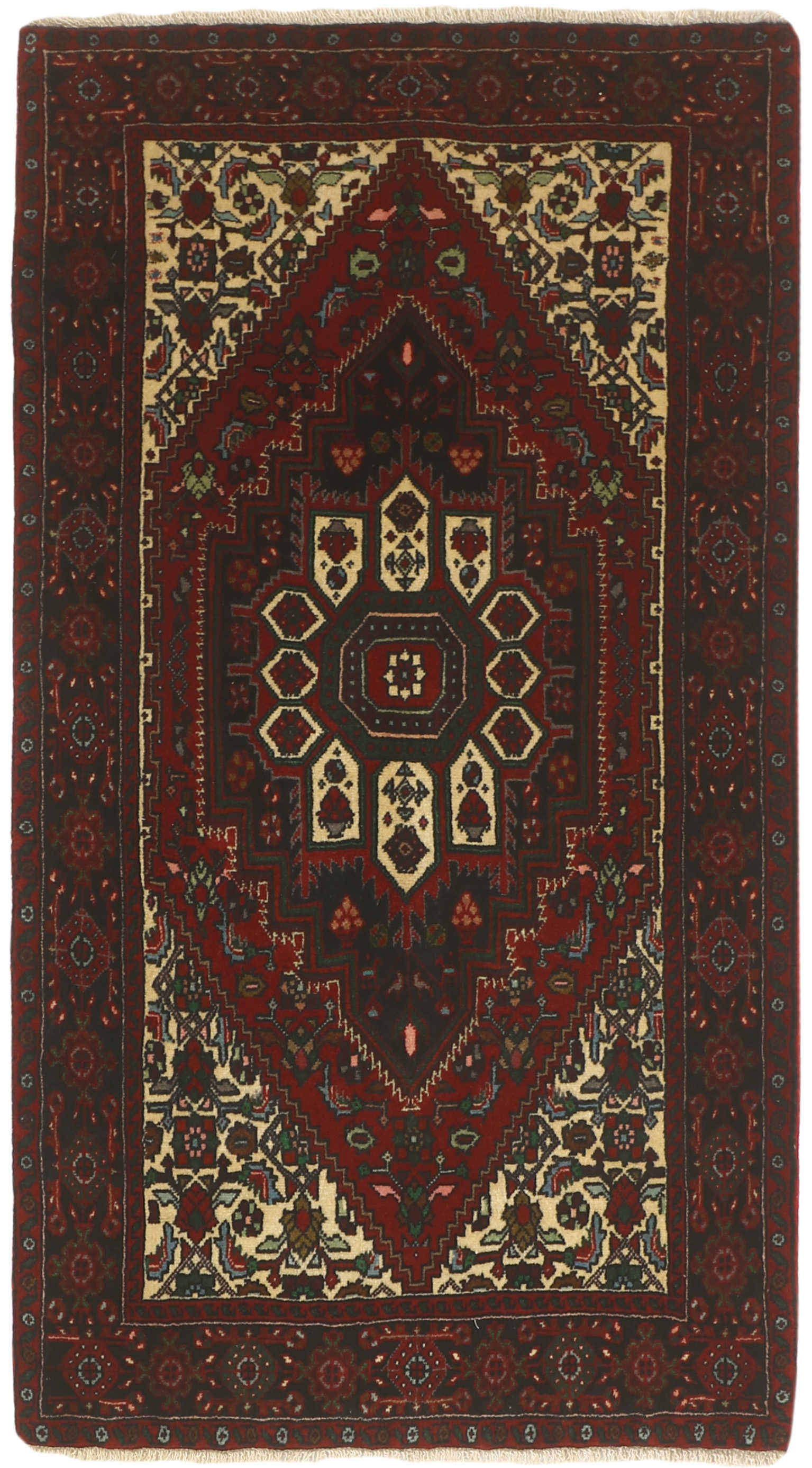 Red and beige persian rug with a floral design