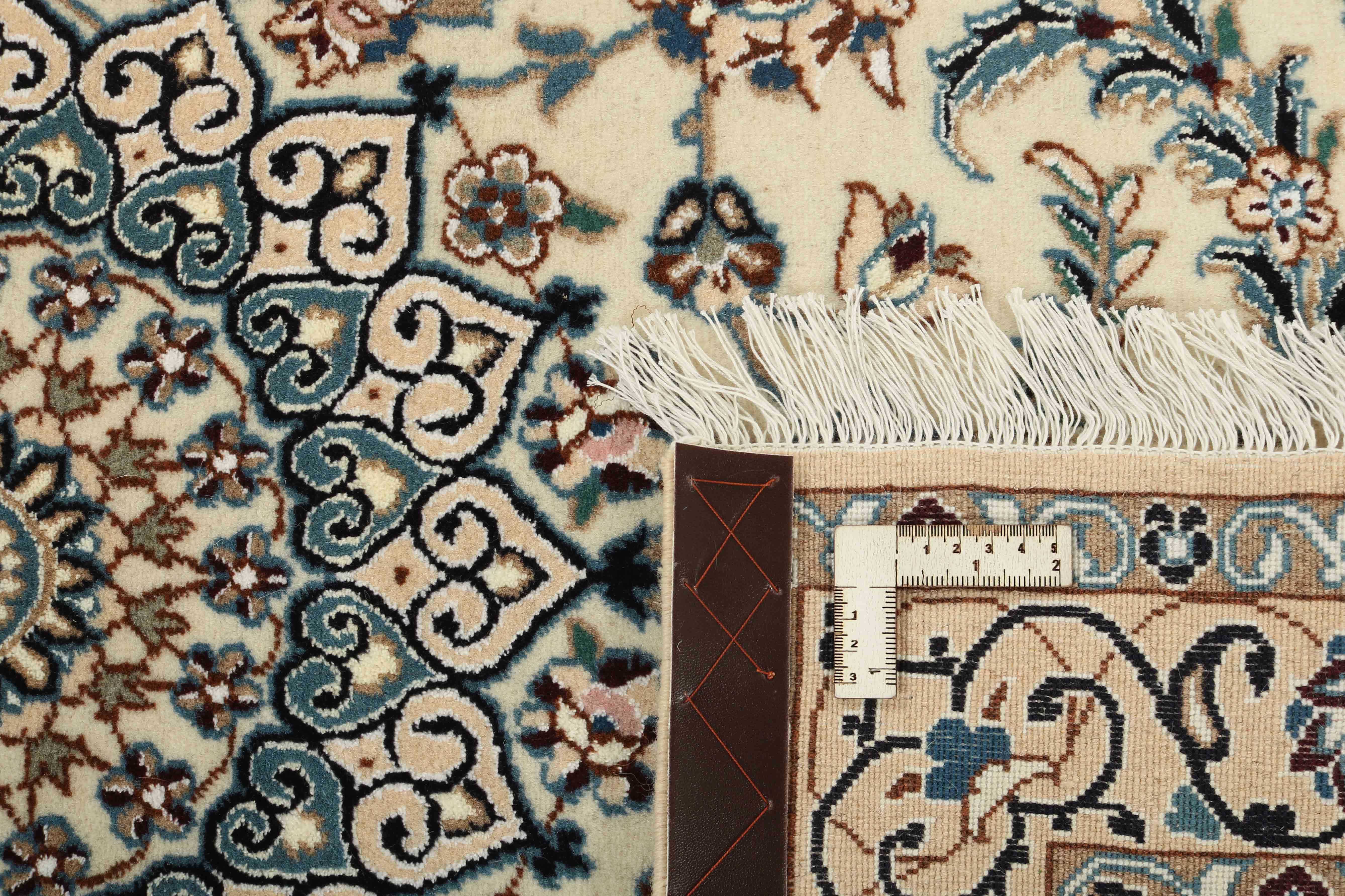 Authentic oriental rug with traditional floral design in beige