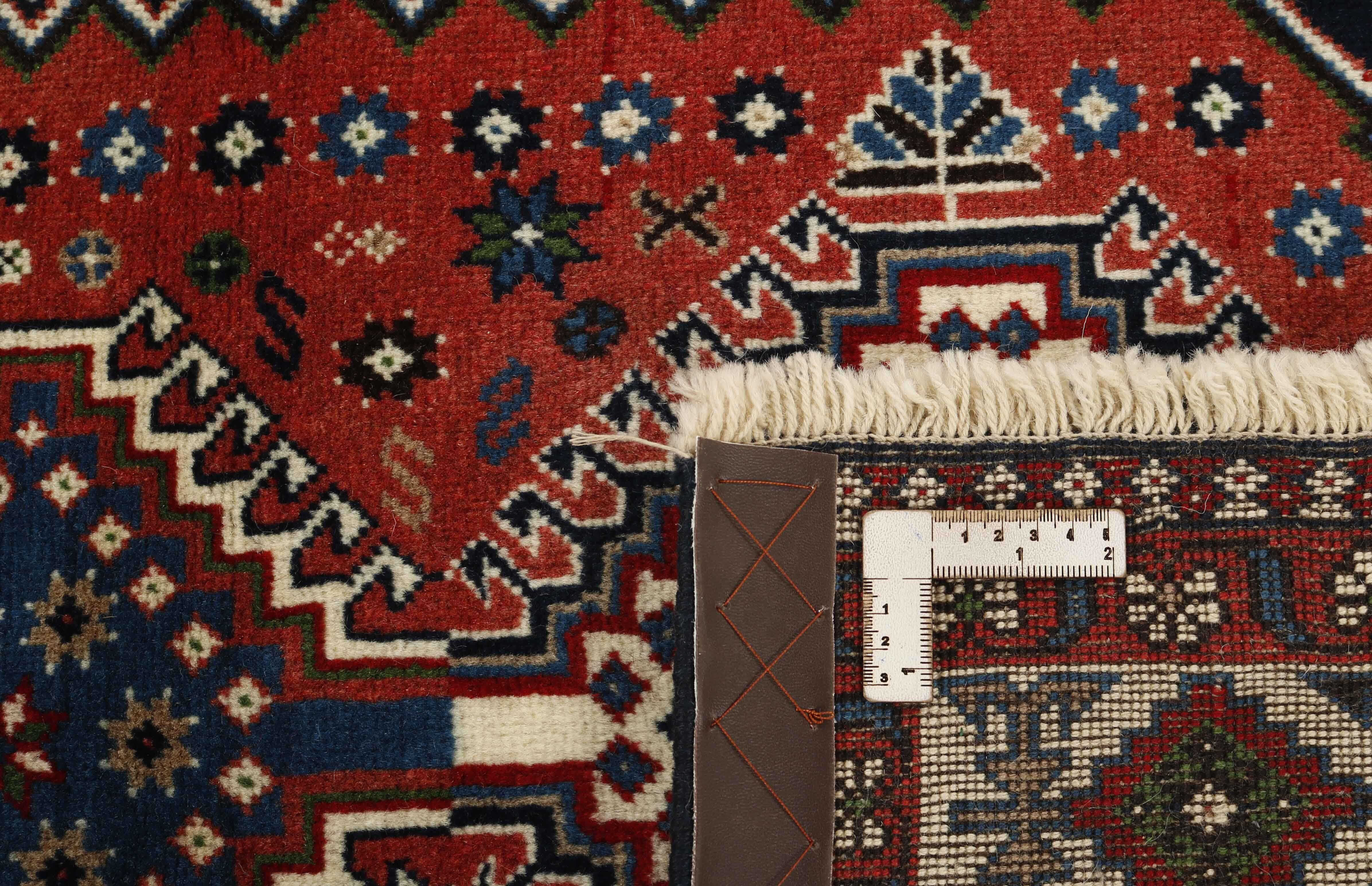 red authentic persian rug with a traditional design