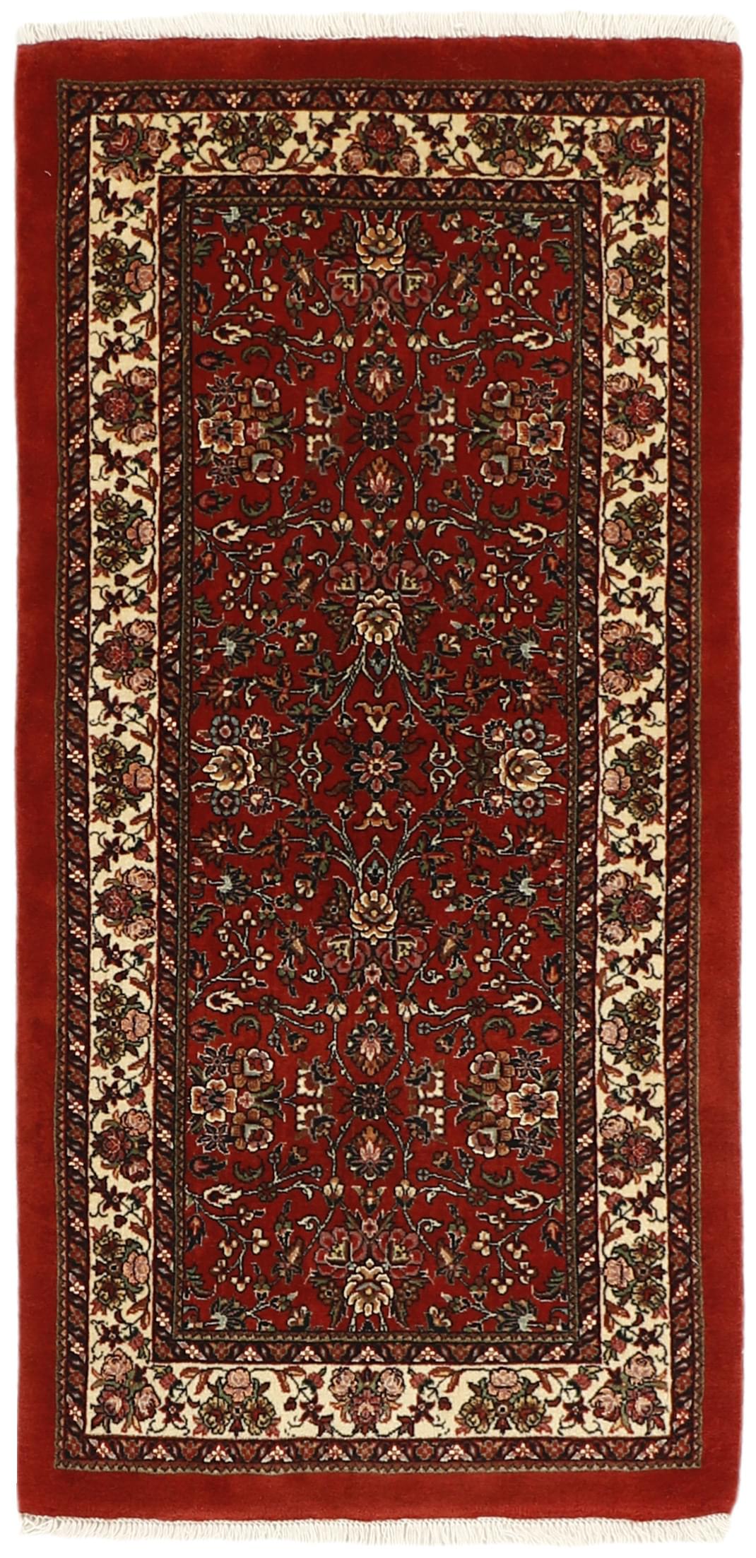 Red and cream persian rug with traditional floral design