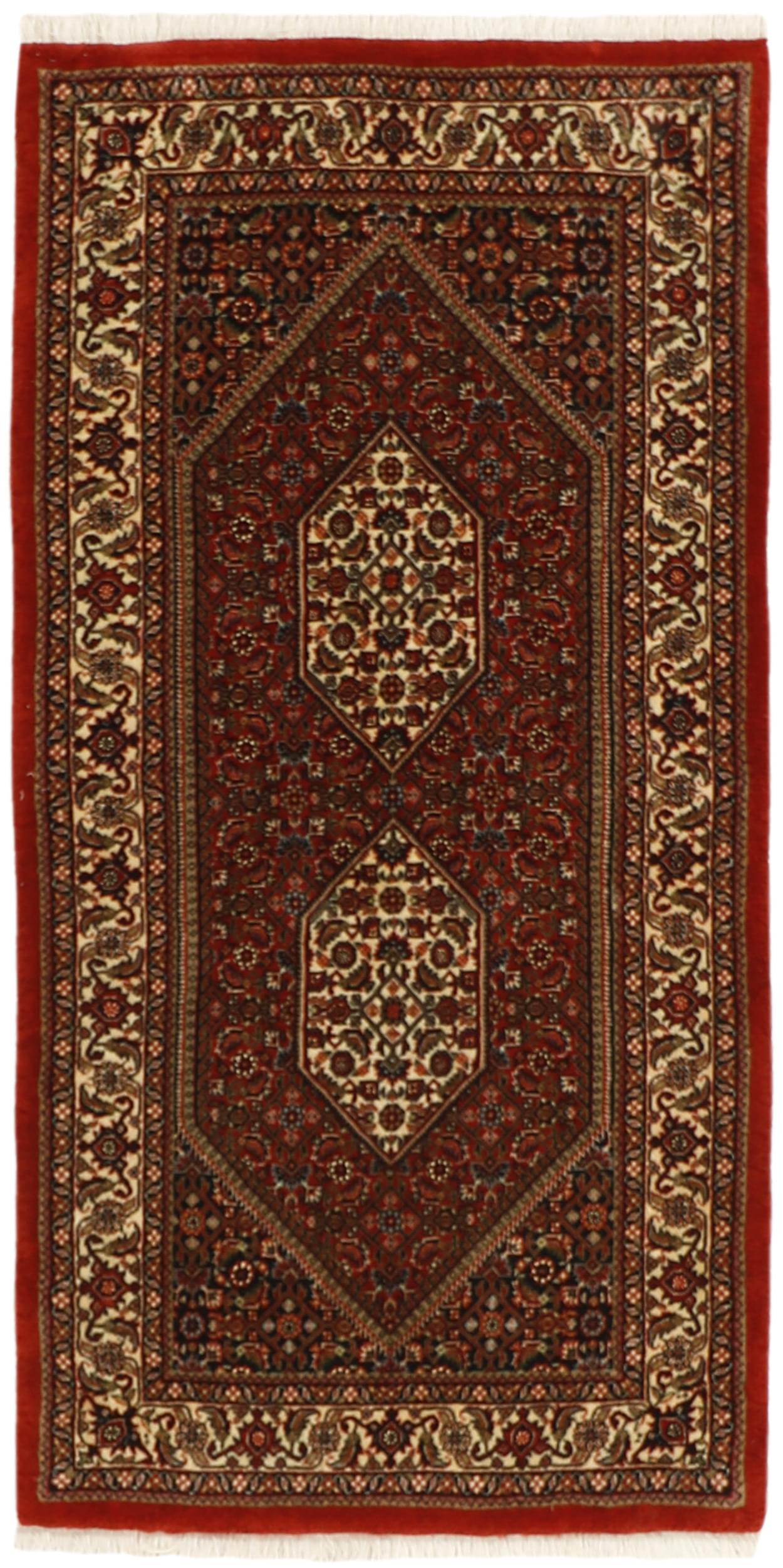 Red and cream persian rug with traditional floral design