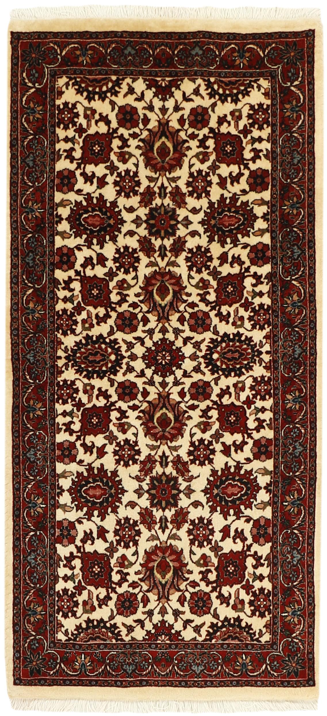Red and cream persian rug with traditional floral design
