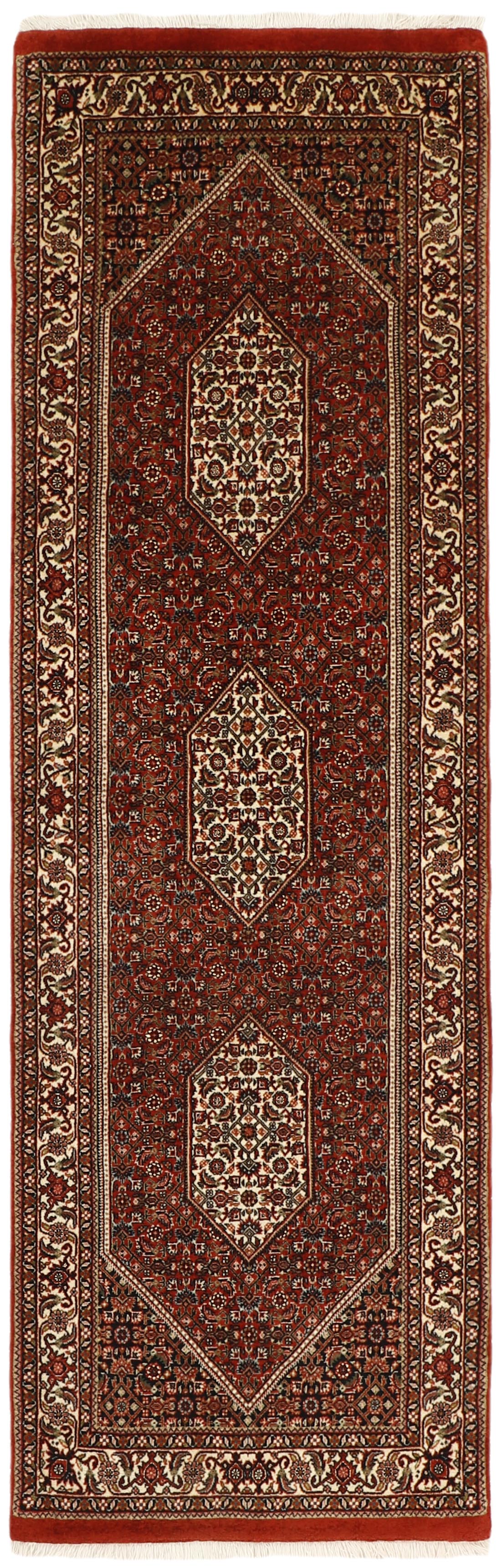 Red persian runner with traditional floral design