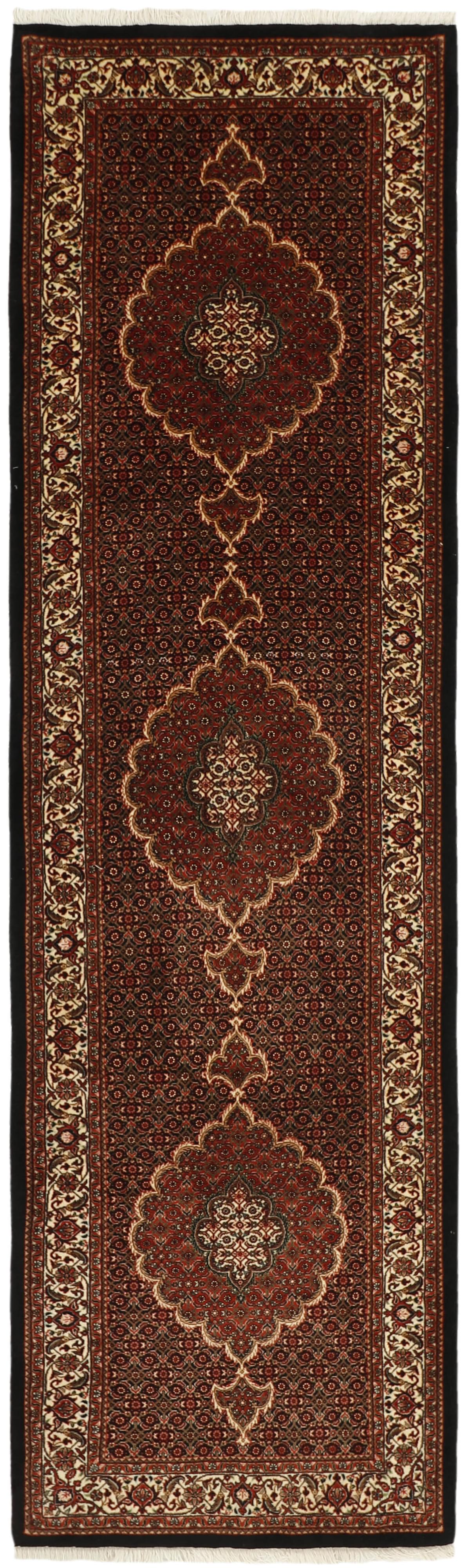 Red and cream persian runner with traditional floral design