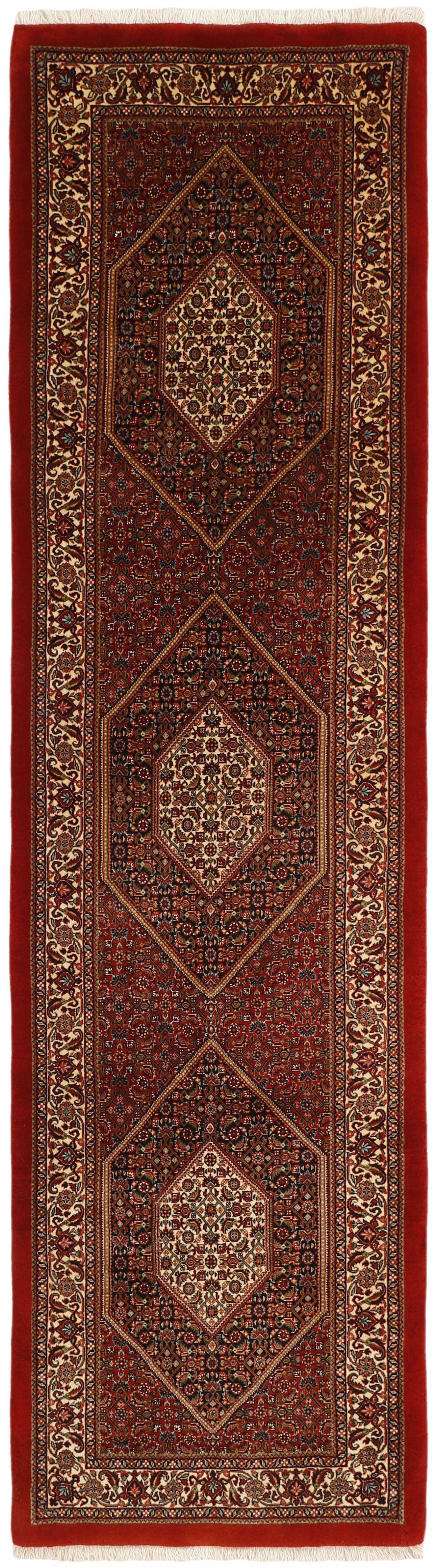 Red persian runner with traditional floral design