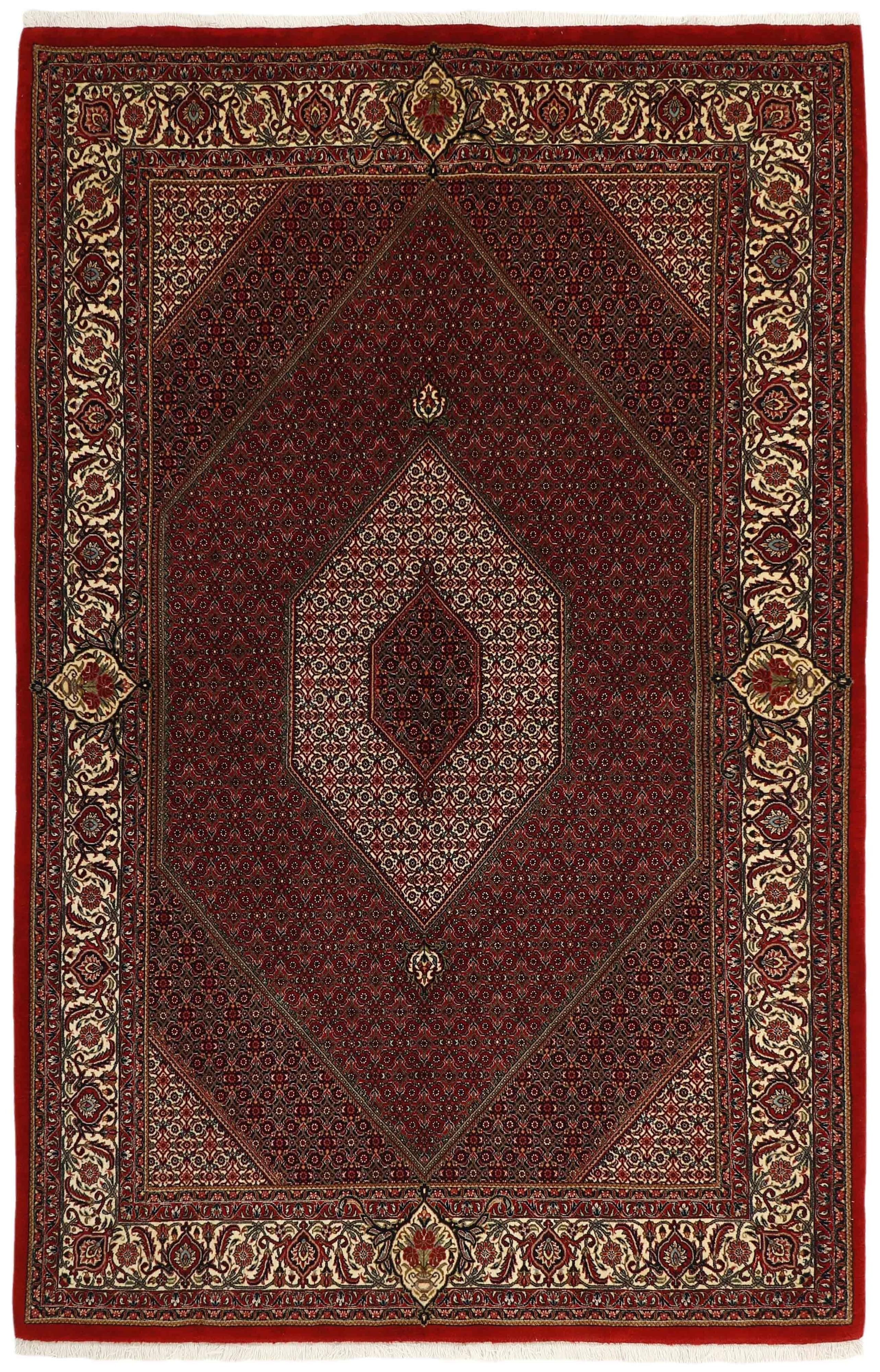 Red and cream persian rug with traditional floral design