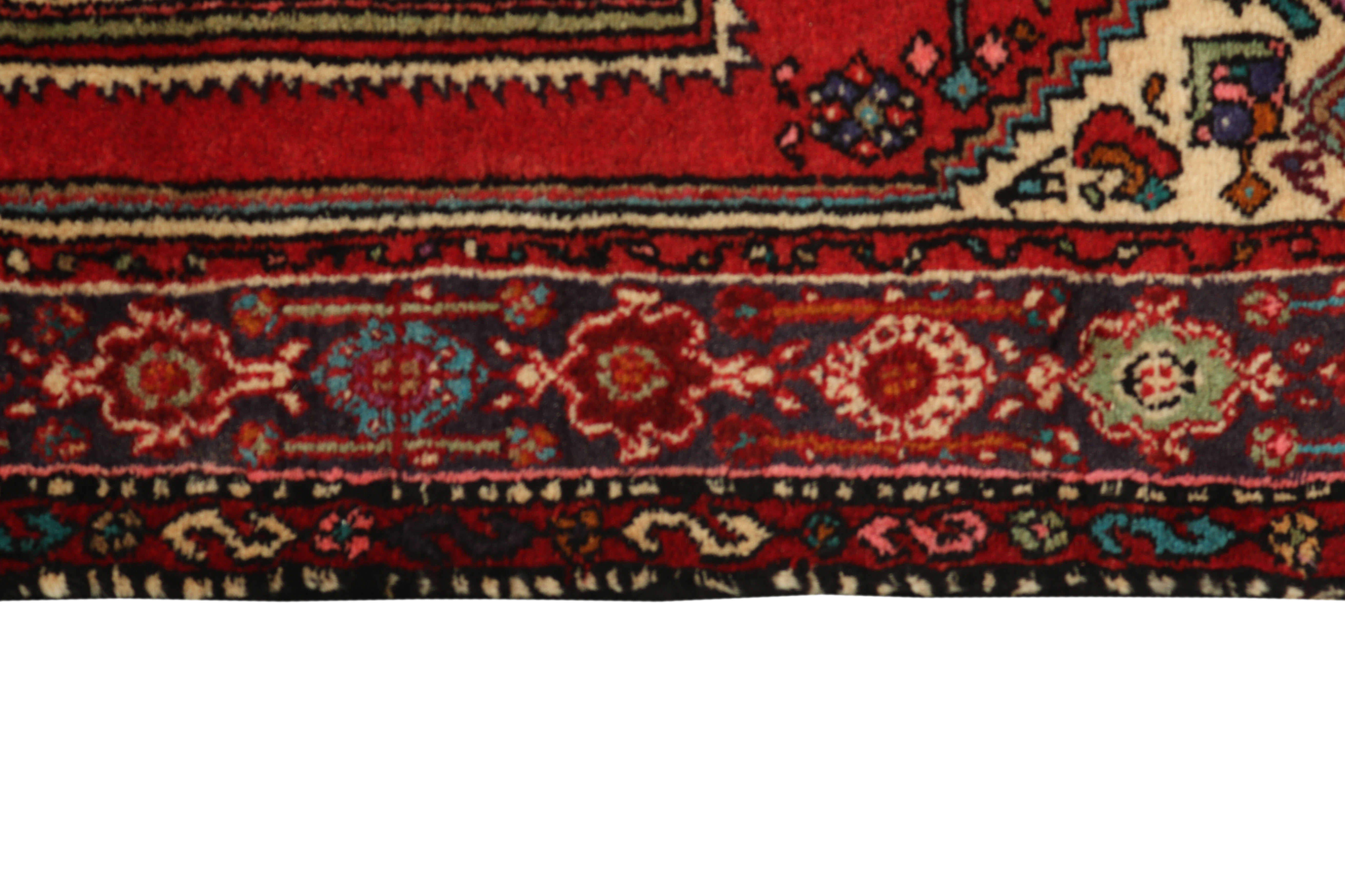 Red persian rug with a floral design