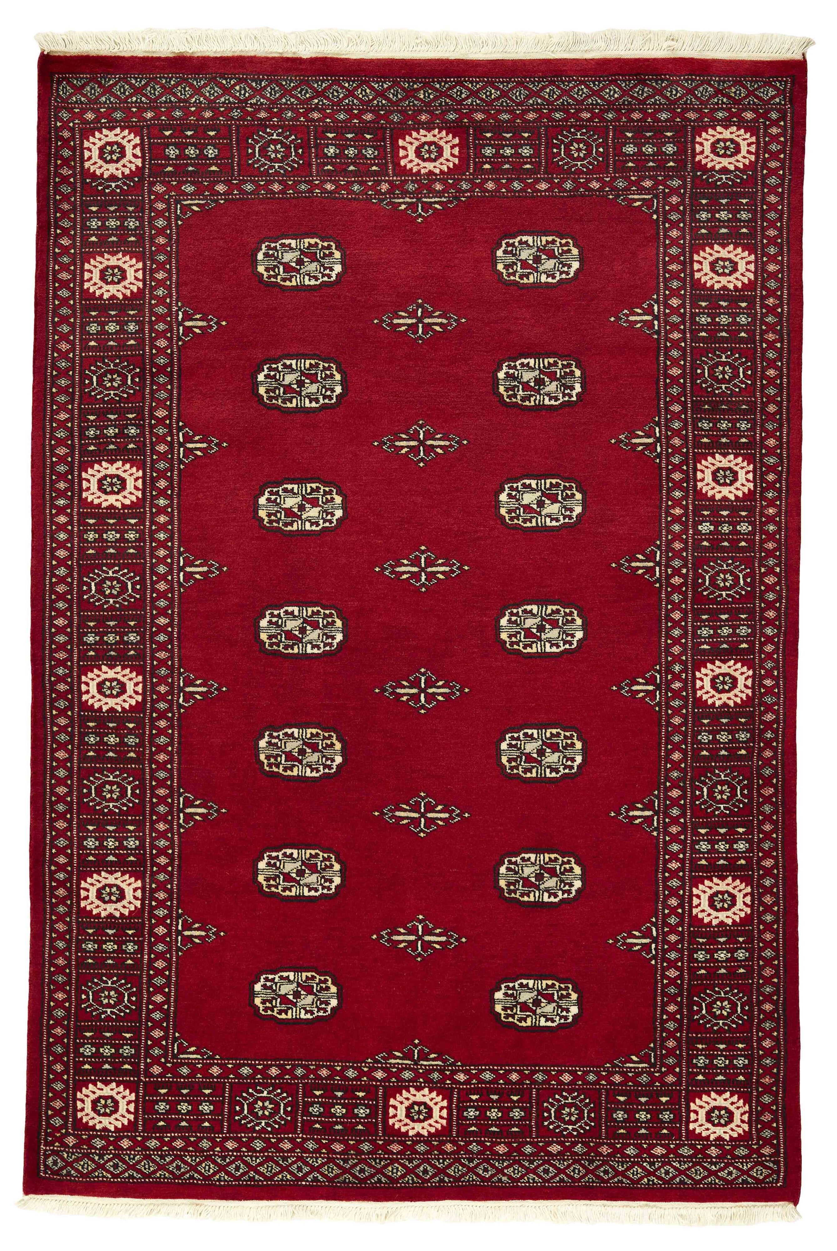 Red Oriental rug with traditional bordered pattern