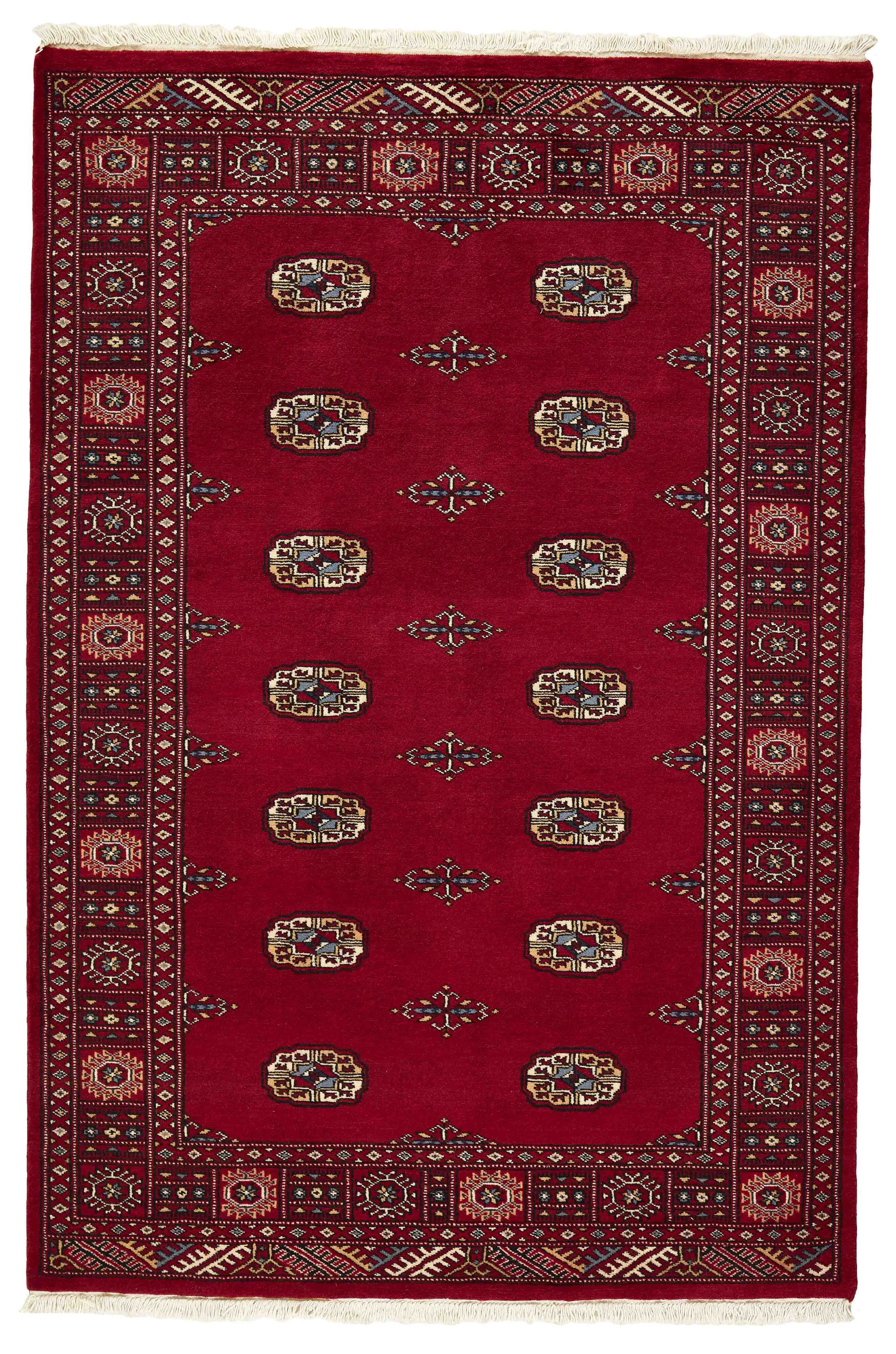 Red Oriental rug with traditional bordered pattern