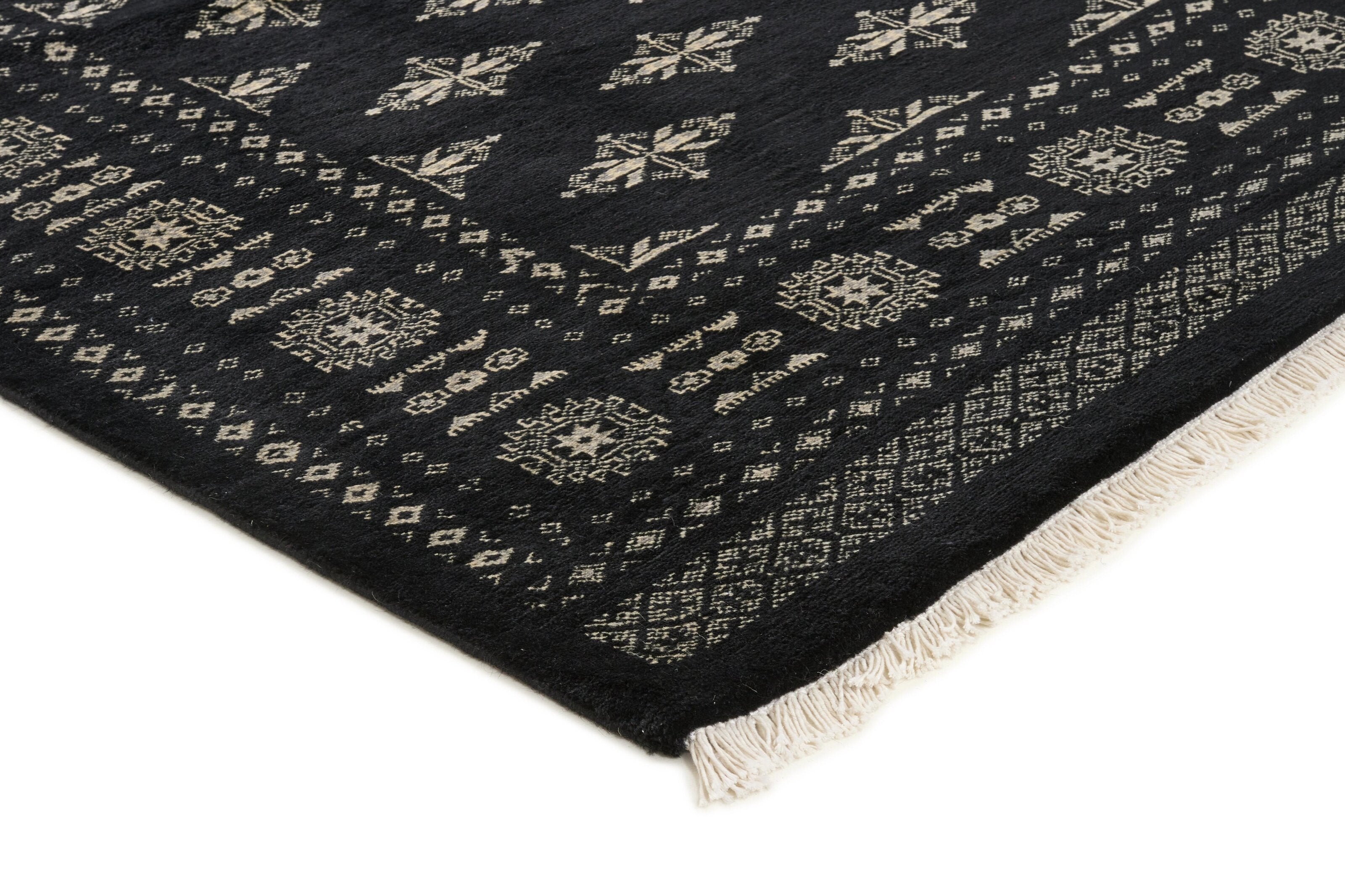 Black Oriental rug with traditional bordered pattern