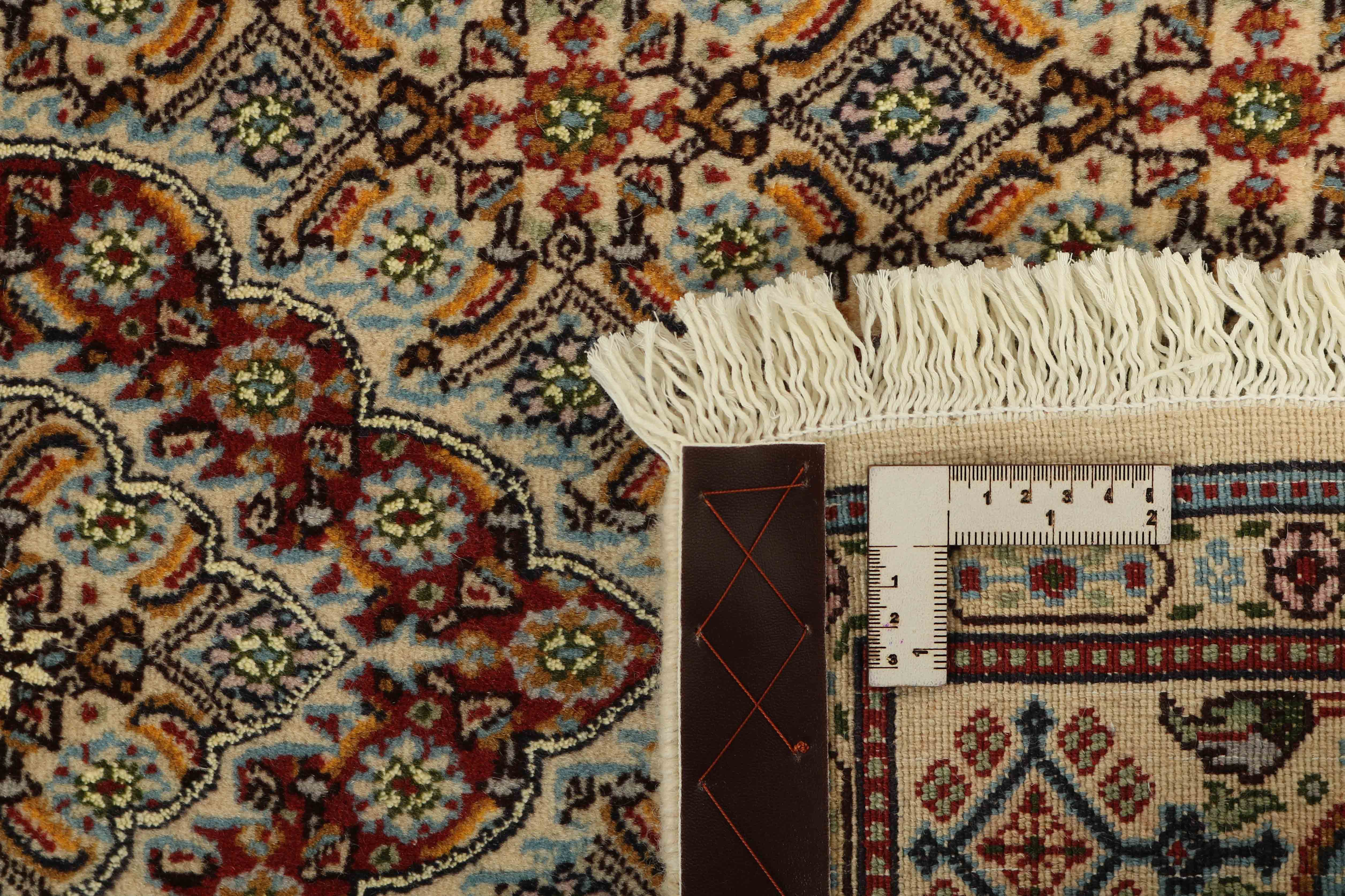 authentic persian rug with traditional floral pattern in beige