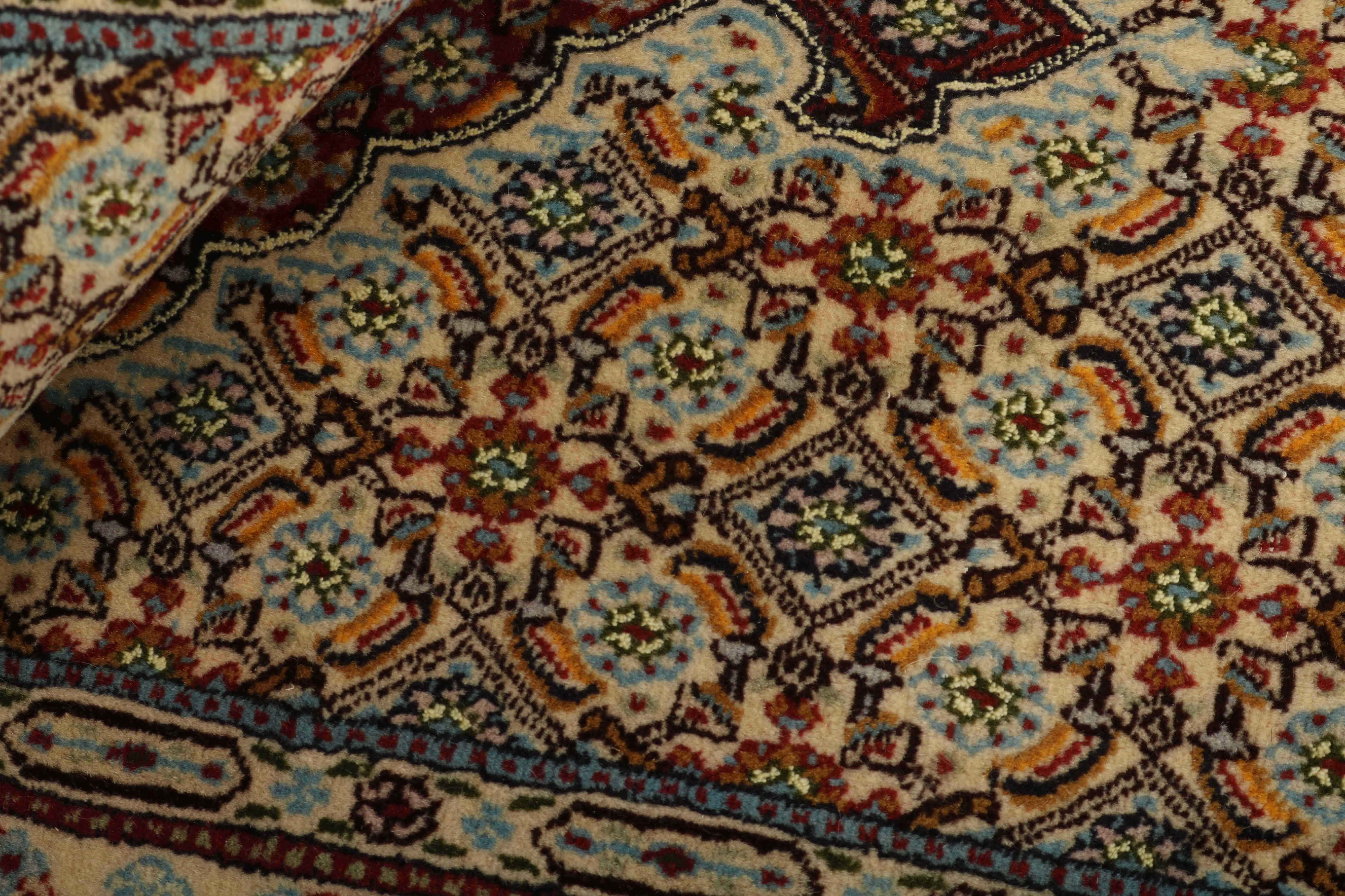 authentic persian rug with traditional floral pattern in beige