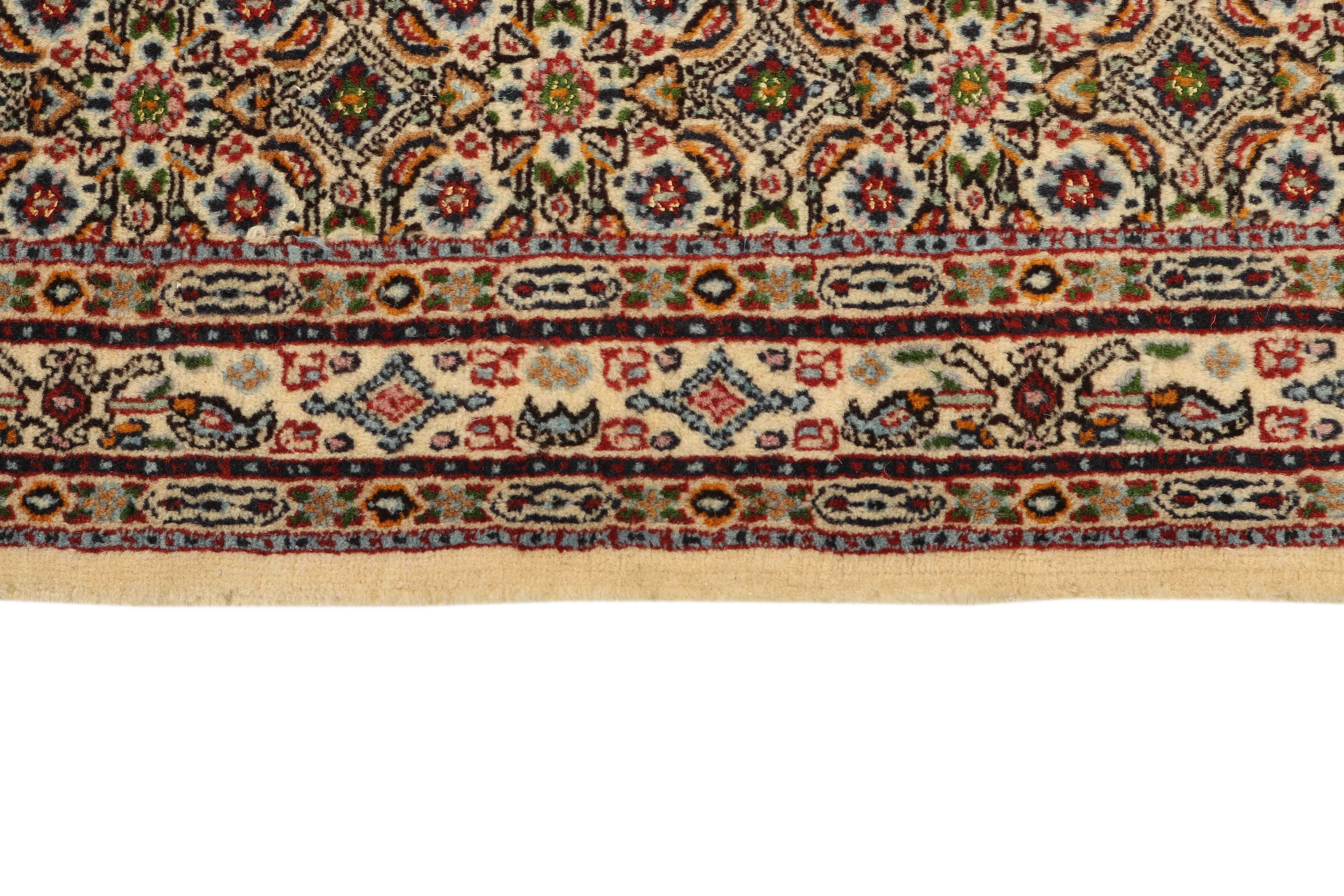 authentic persian rug with traditional floral pattern in beige