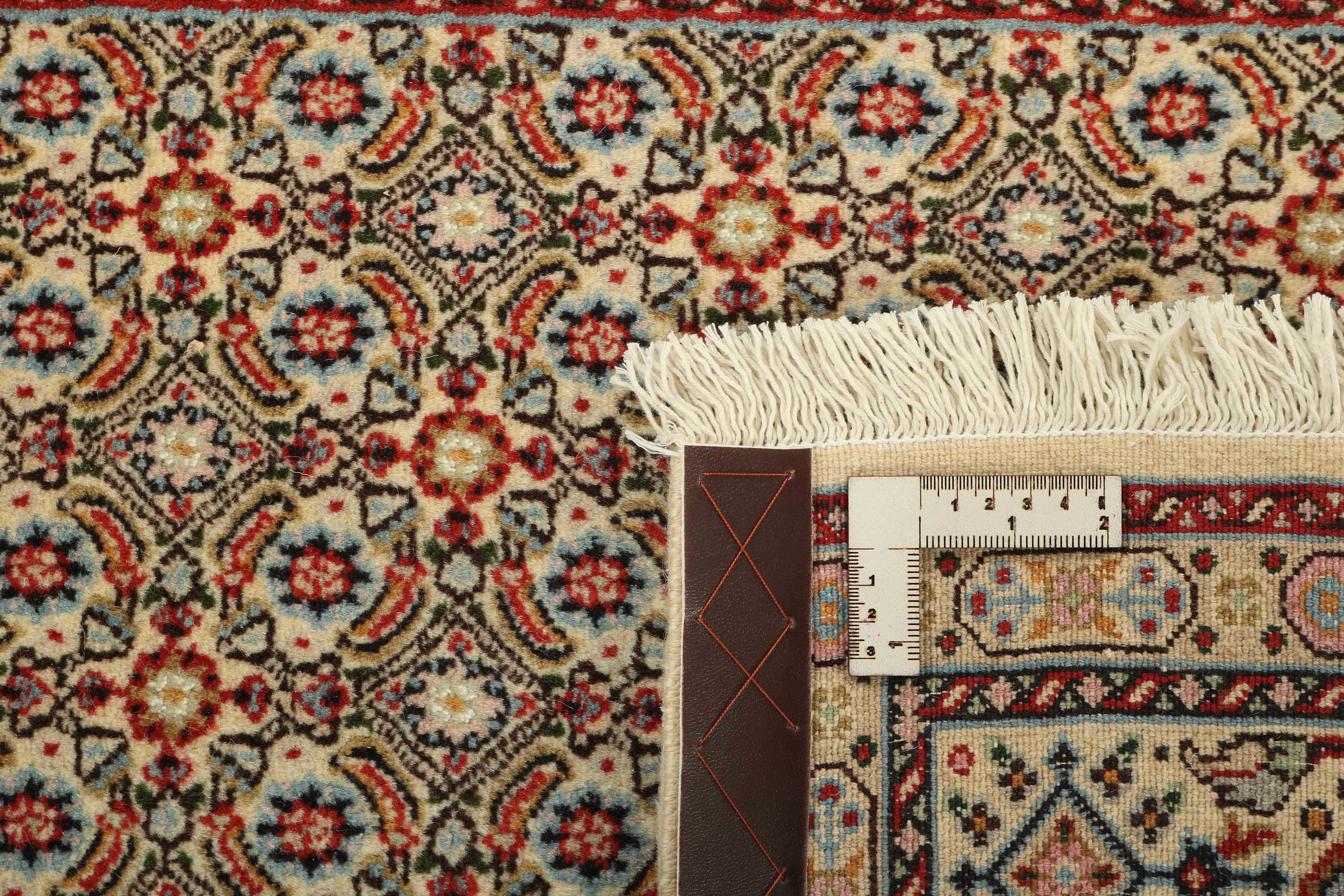 authentic persian rug with traditional floral pattern in beige