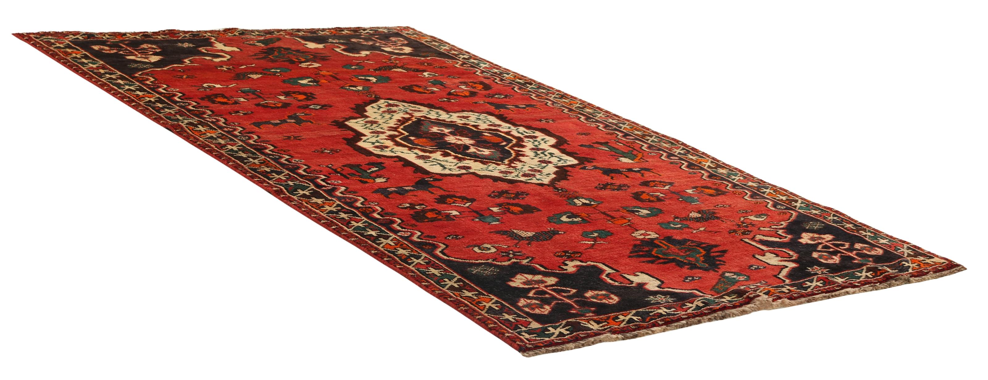 Authentic persian rug with a traditional tribal geometric pattern in red