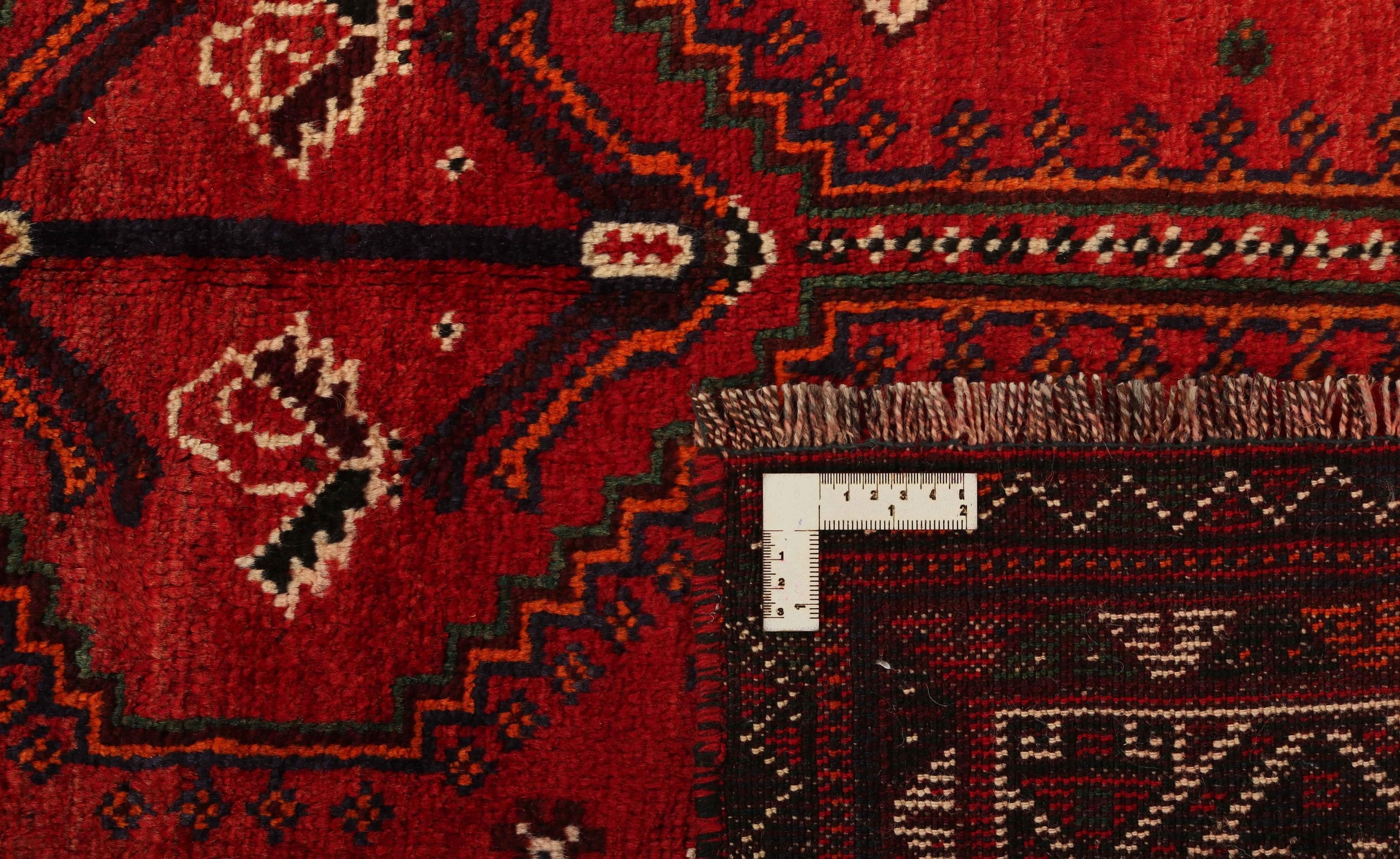 Authentic persian rug with a traditional tribal geometric pattern in red