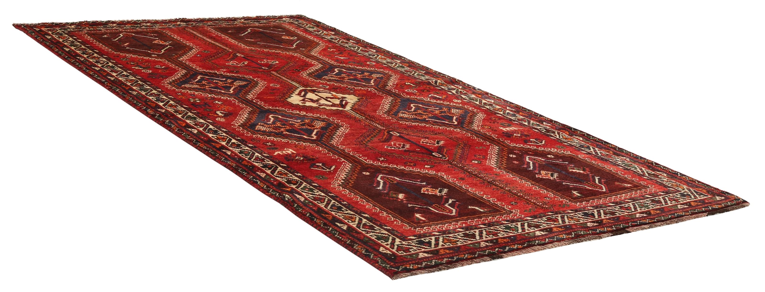 Authentic persian rug with a traditional tribal geometric pattern in red