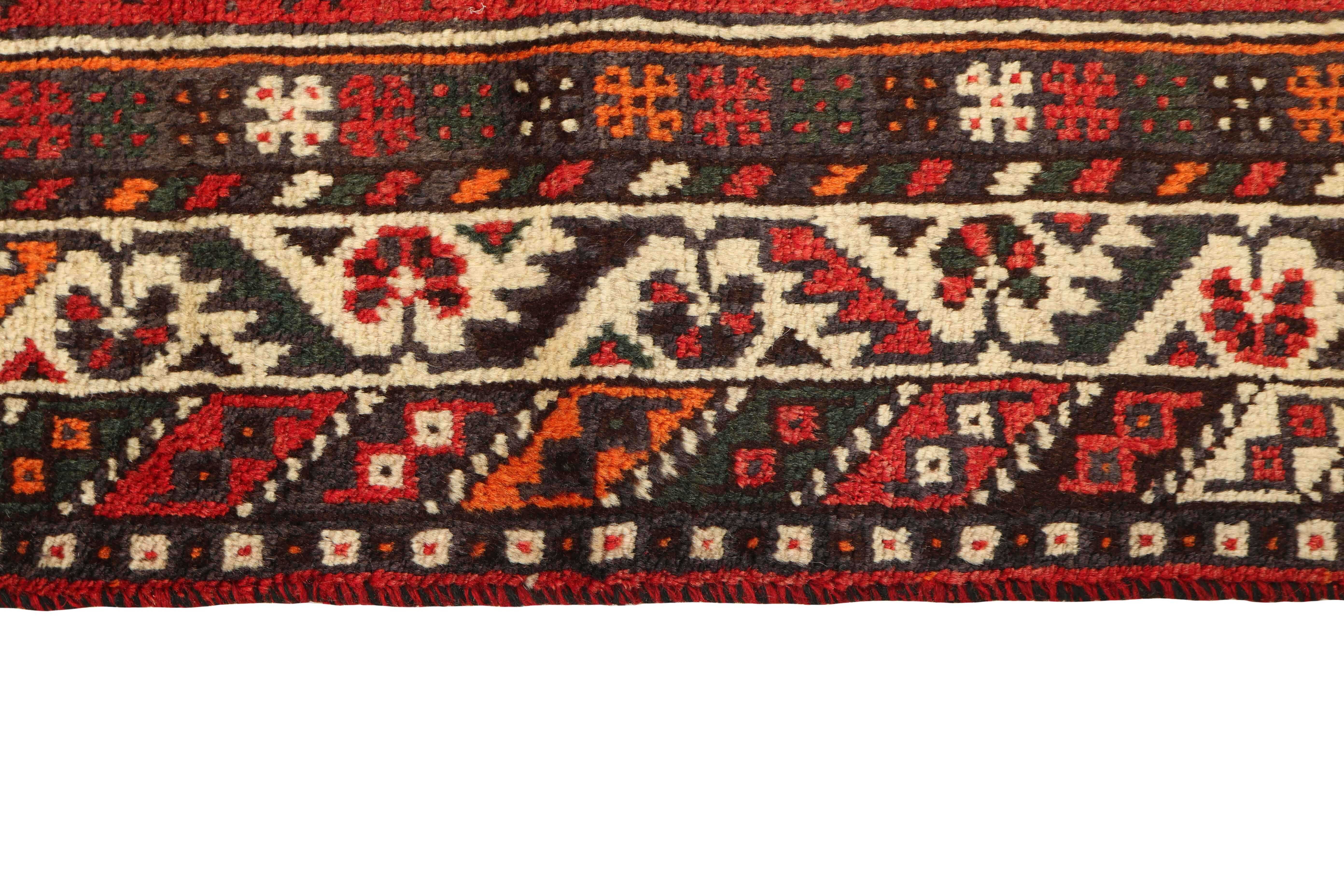 Authentic persian rug with a traditional tribal geometric pattern in red