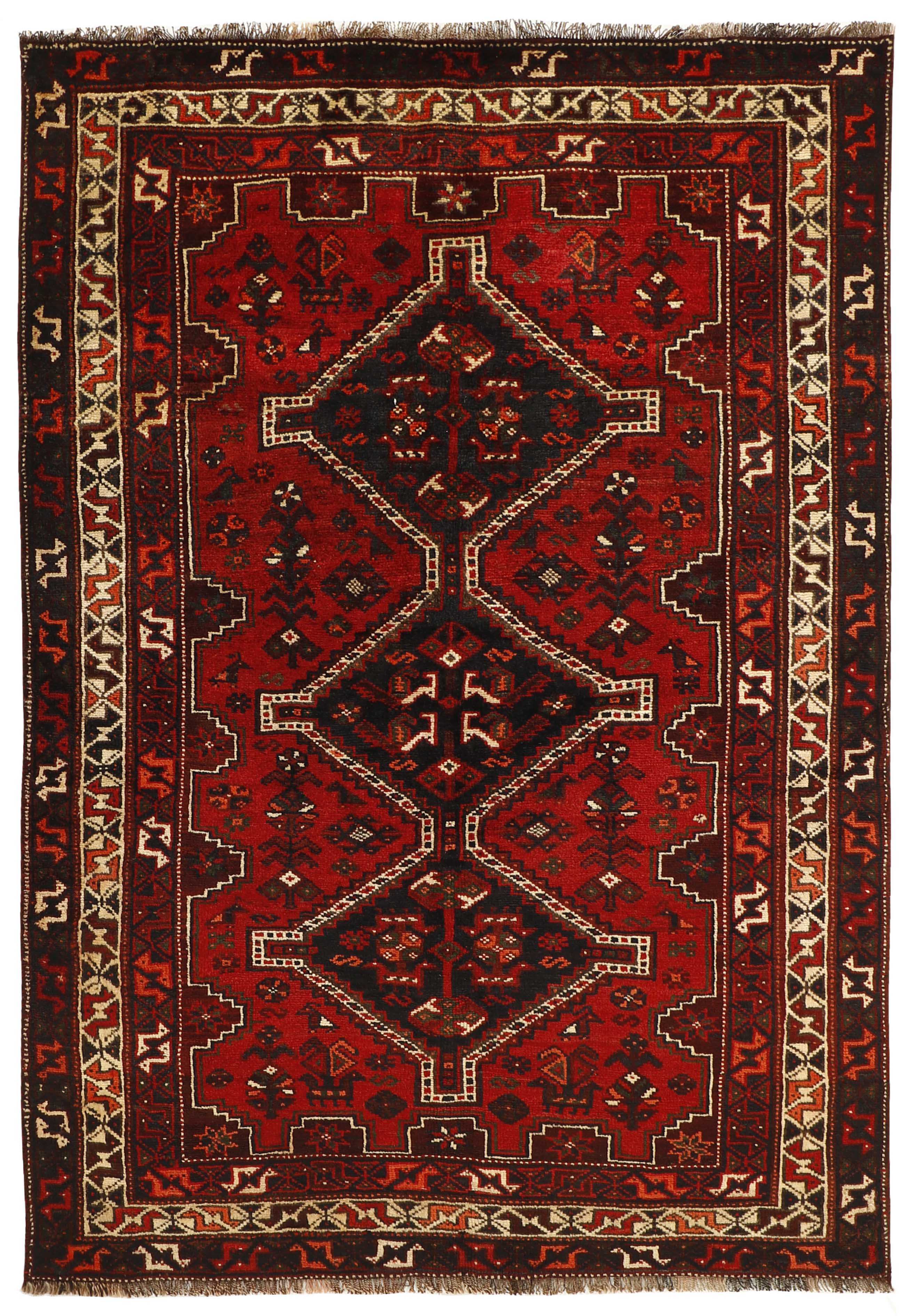 Authentic persian rug with a traditional tribal geometric pattern in red, black and beige