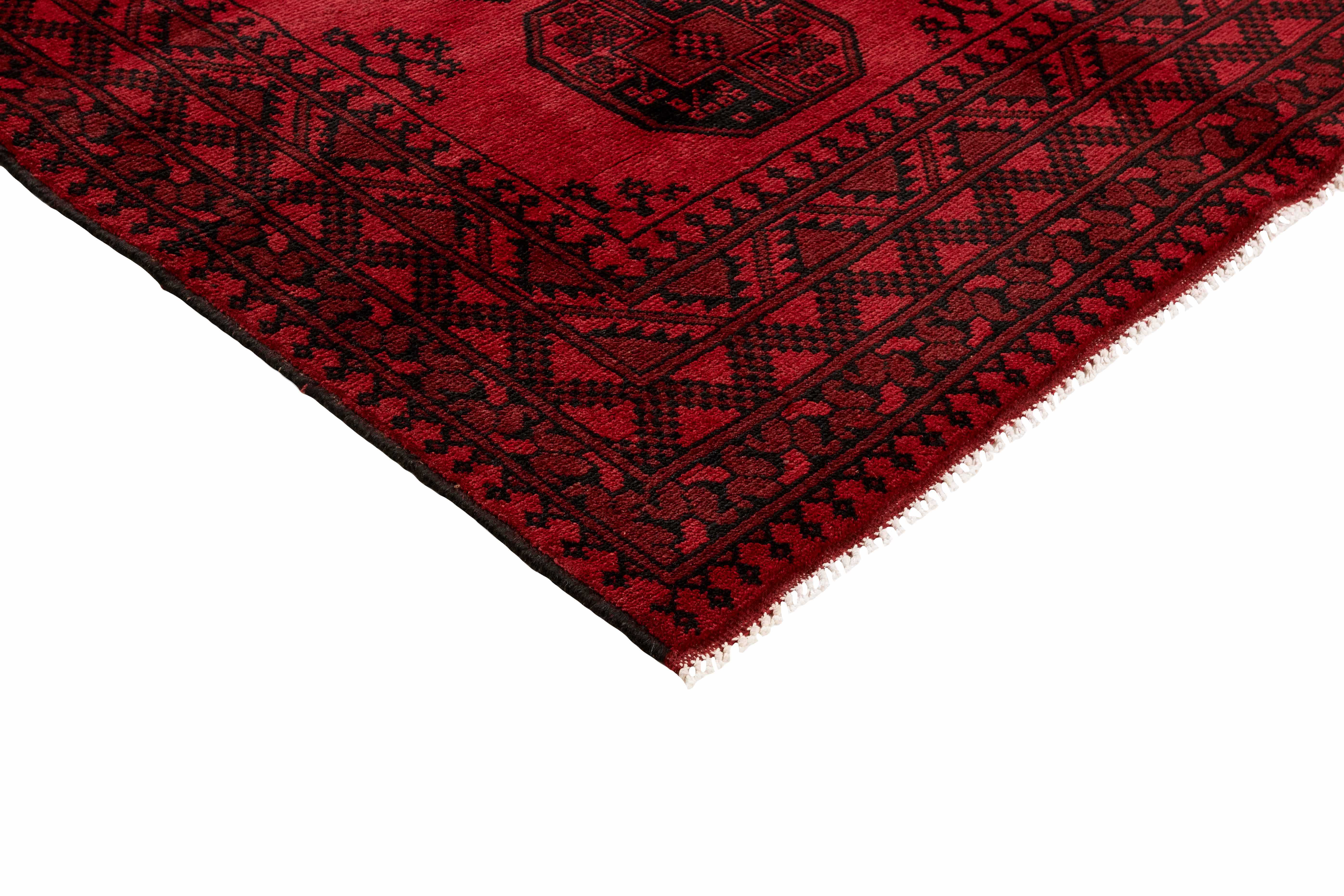 Red oriental rug with traditional elephant's foot pattern