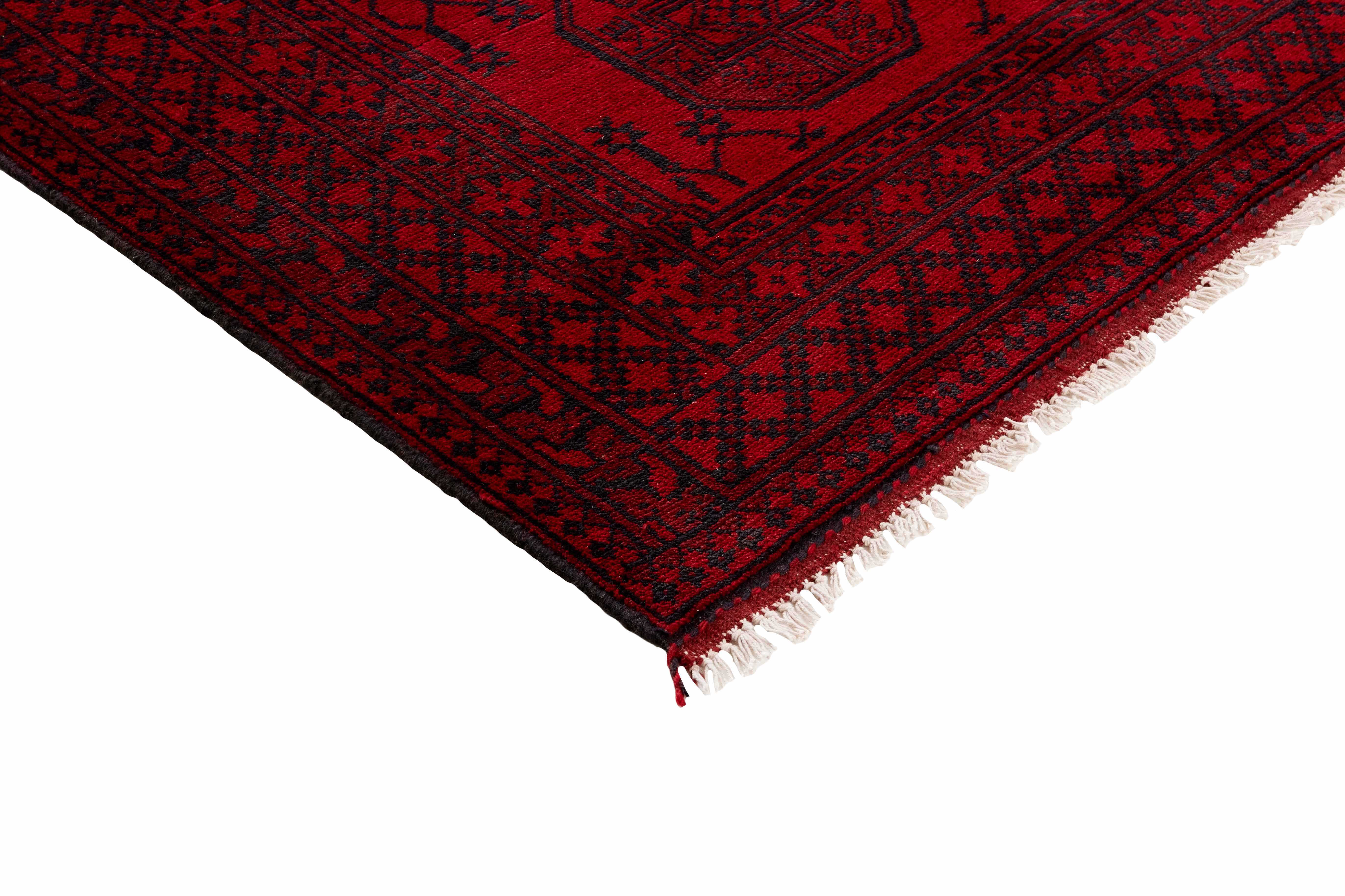 Red oriental rug with traditional elephant's foot pattern