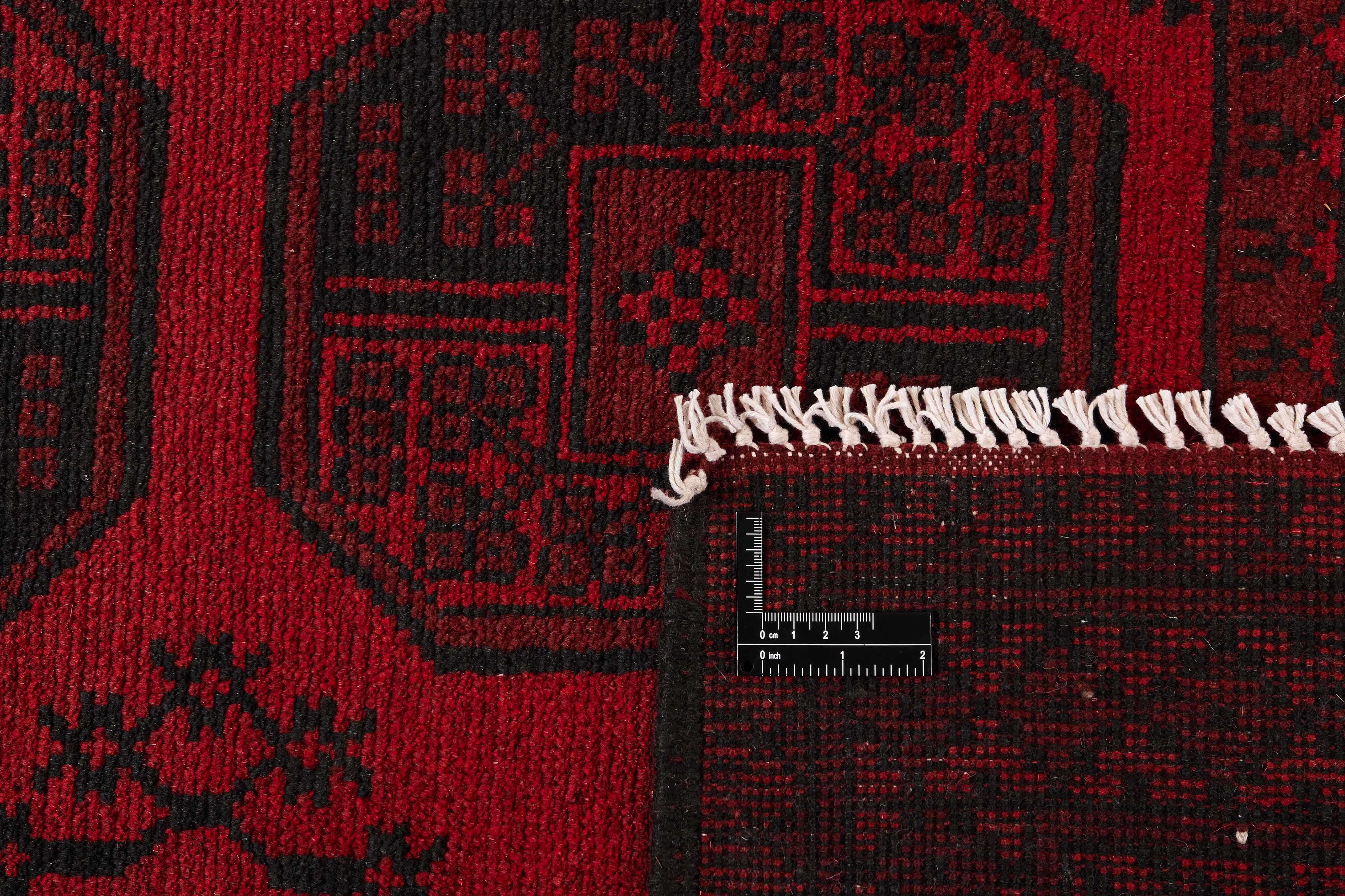 Red oriental rug with traditional elephant's foot pattern