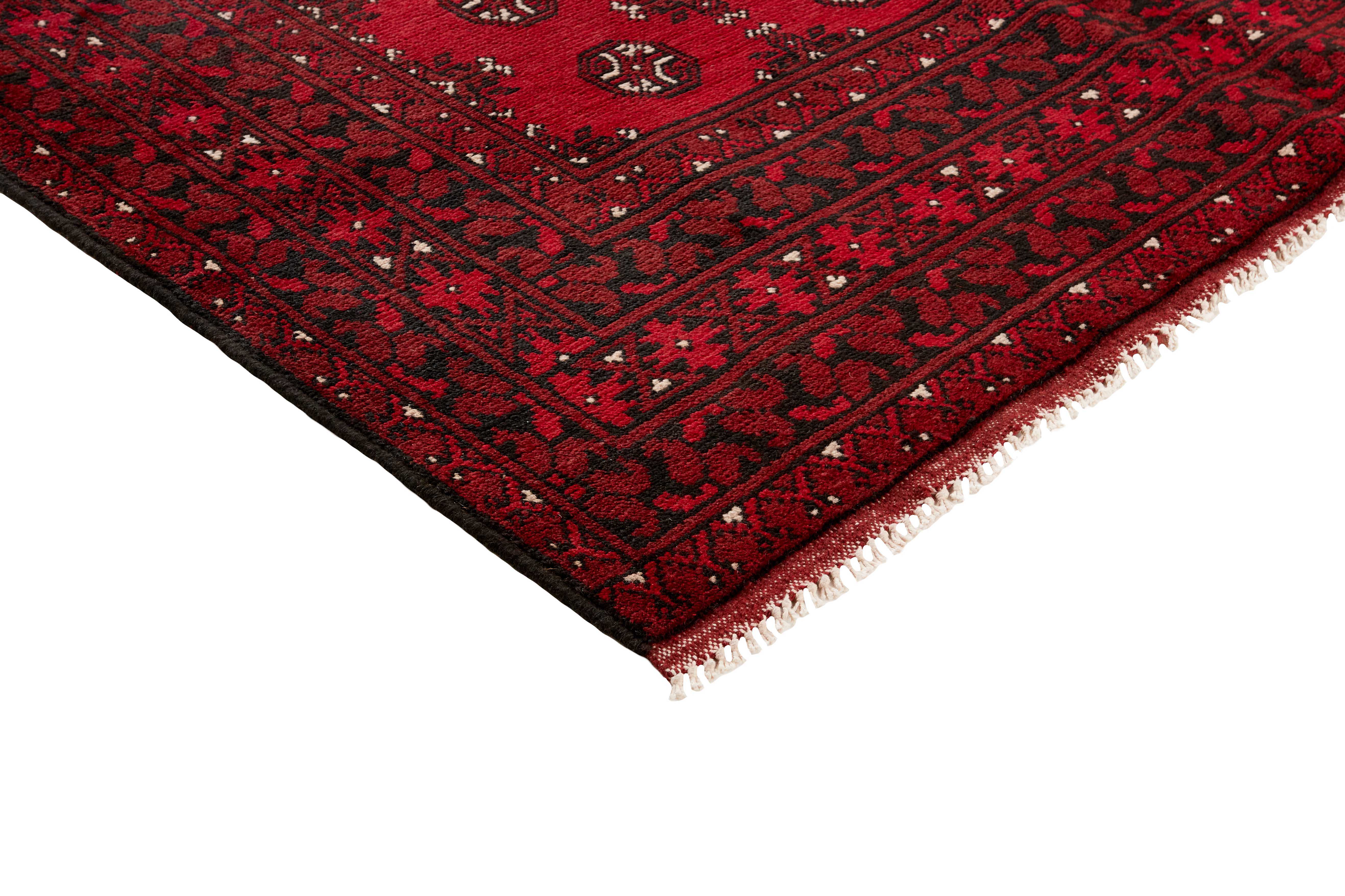 Red oriental rug with traditional elephant's foot pattern