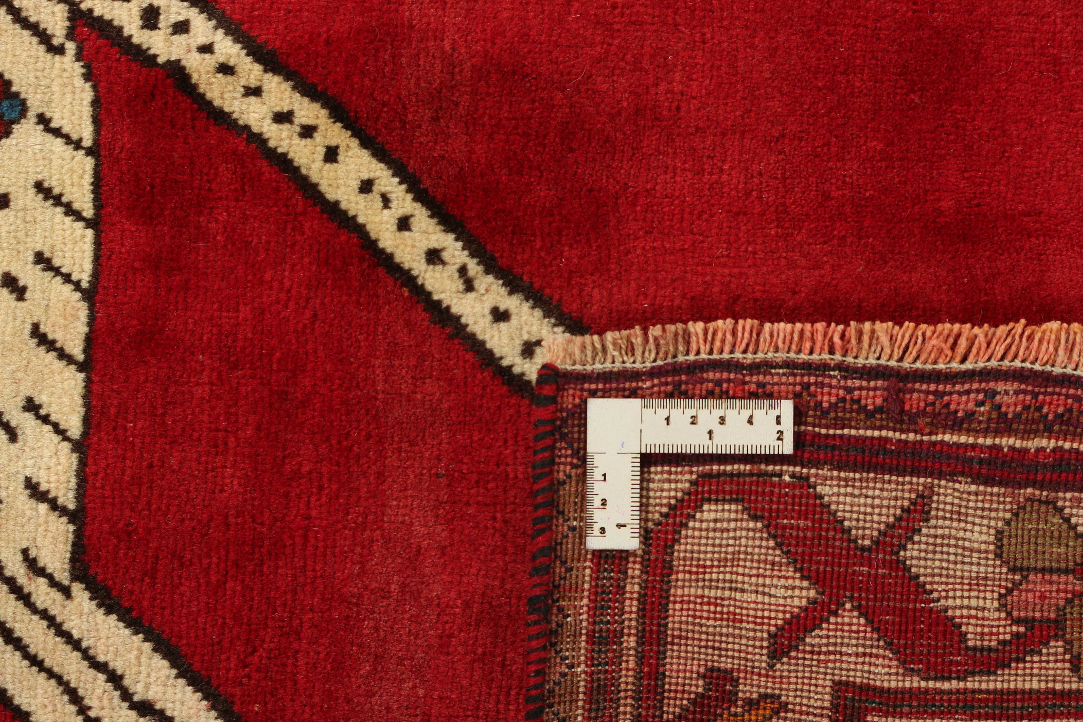 red persian rug with figural design