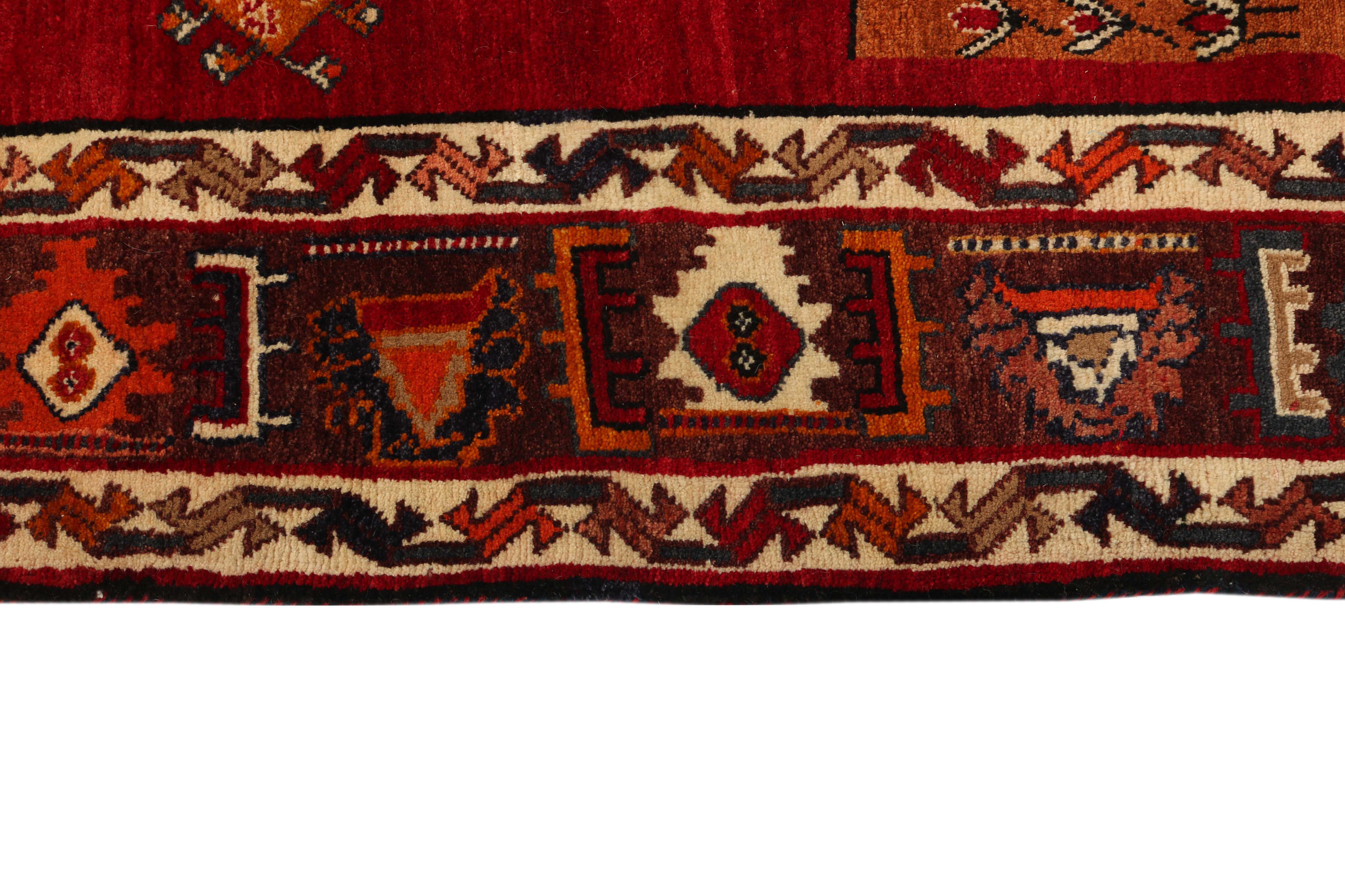 red persian rug with figural design