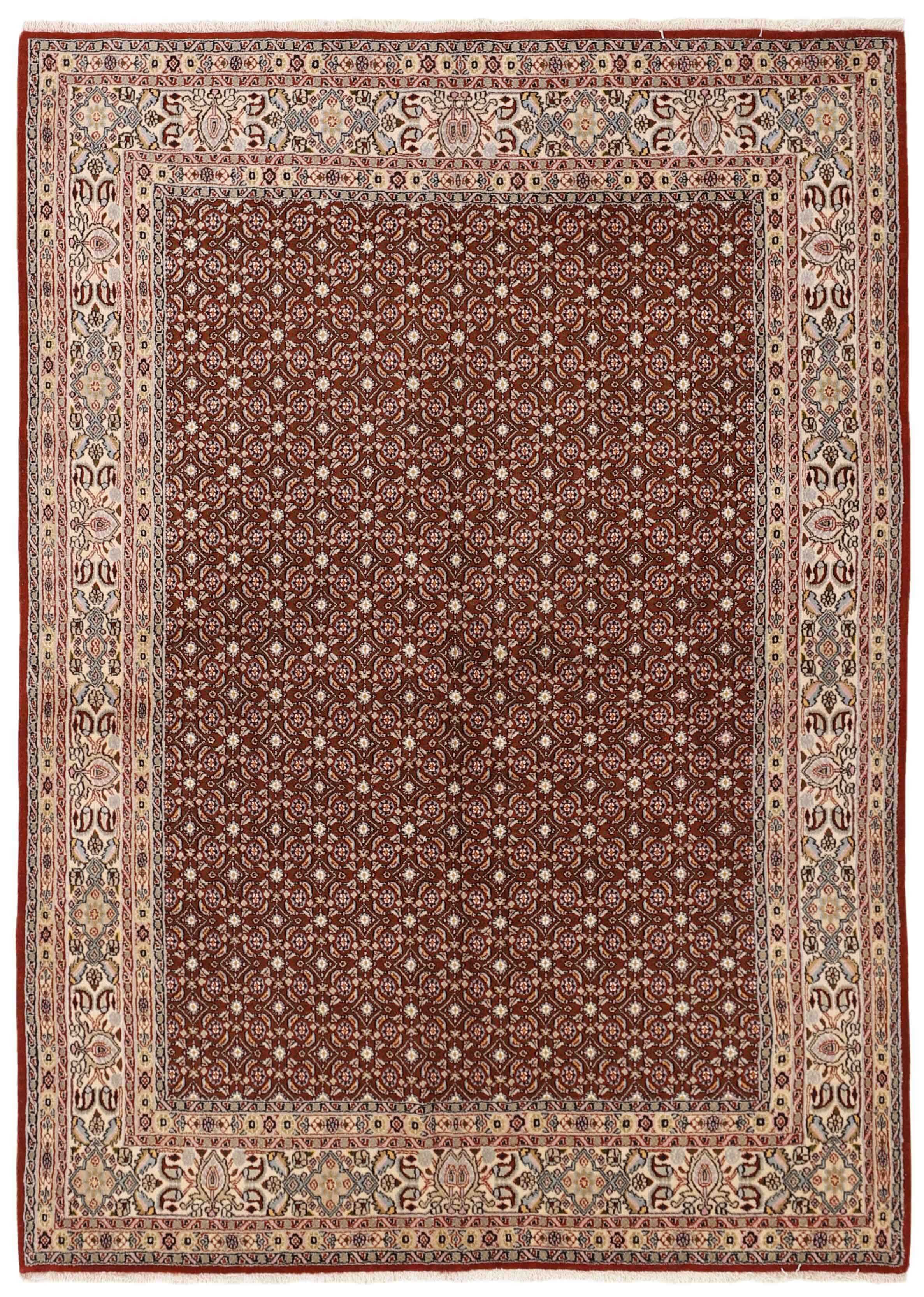 authentic persian rug with traditional floral pattern in cream, blue and red