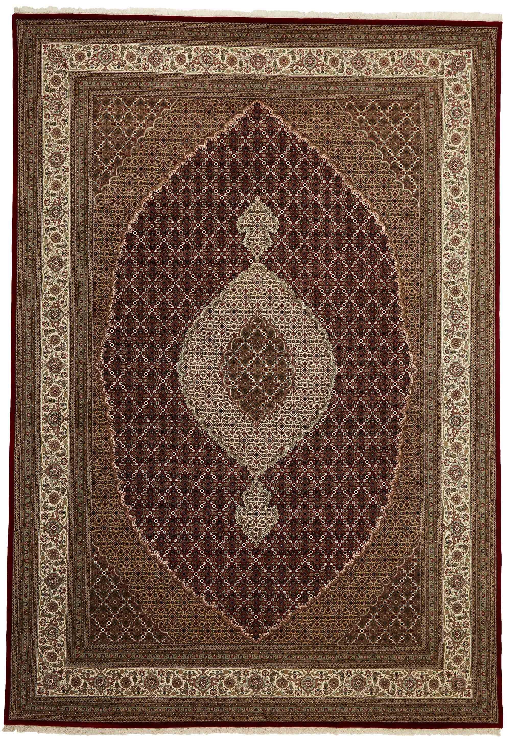 Authentic Oriental rug with traditional geometric and floral design in red, blue, green, beige, brown and black