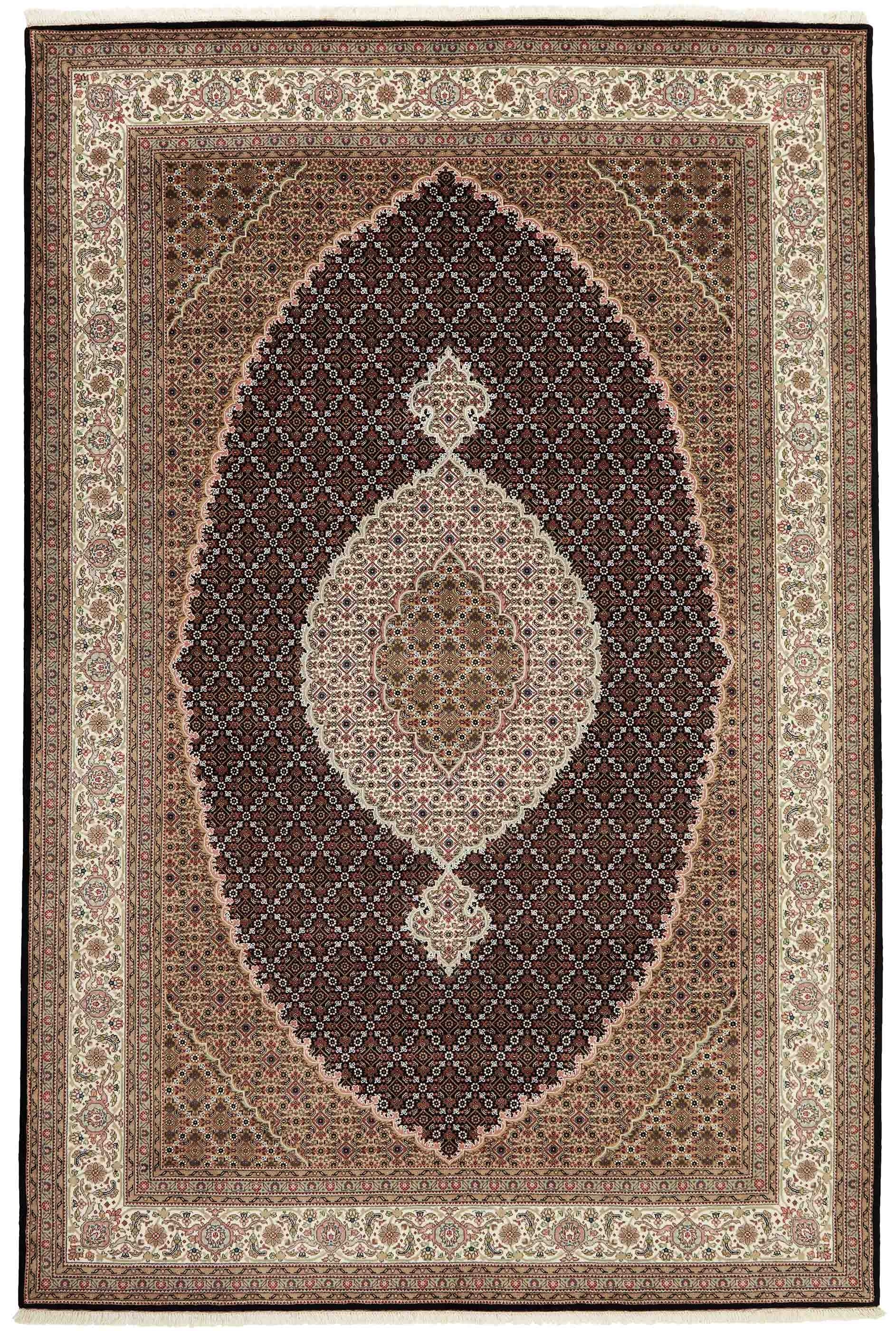 Authentic Oriental rug with traditional geometric and floral design in red, blue, green, beige, brown and black