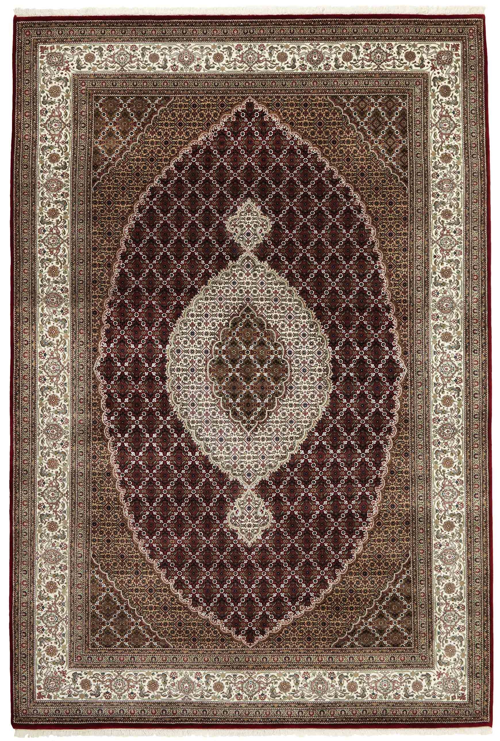 Authentic Oriental rug with traditional geometric and floral design in red, blue, green, beige, brown and black