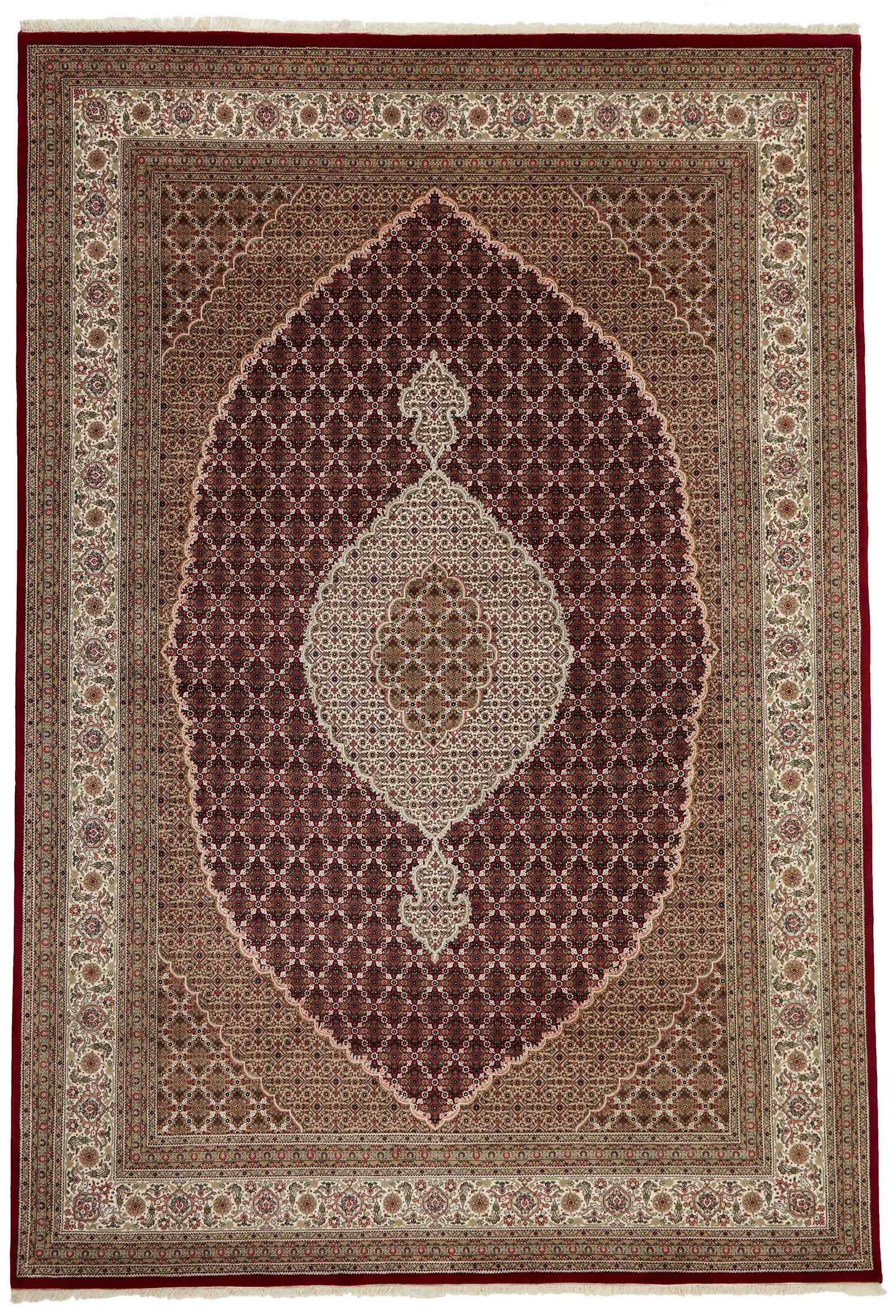 Authentic Oriental rug with traditional geometric and floral design in red, blue, green, beige, brown and black