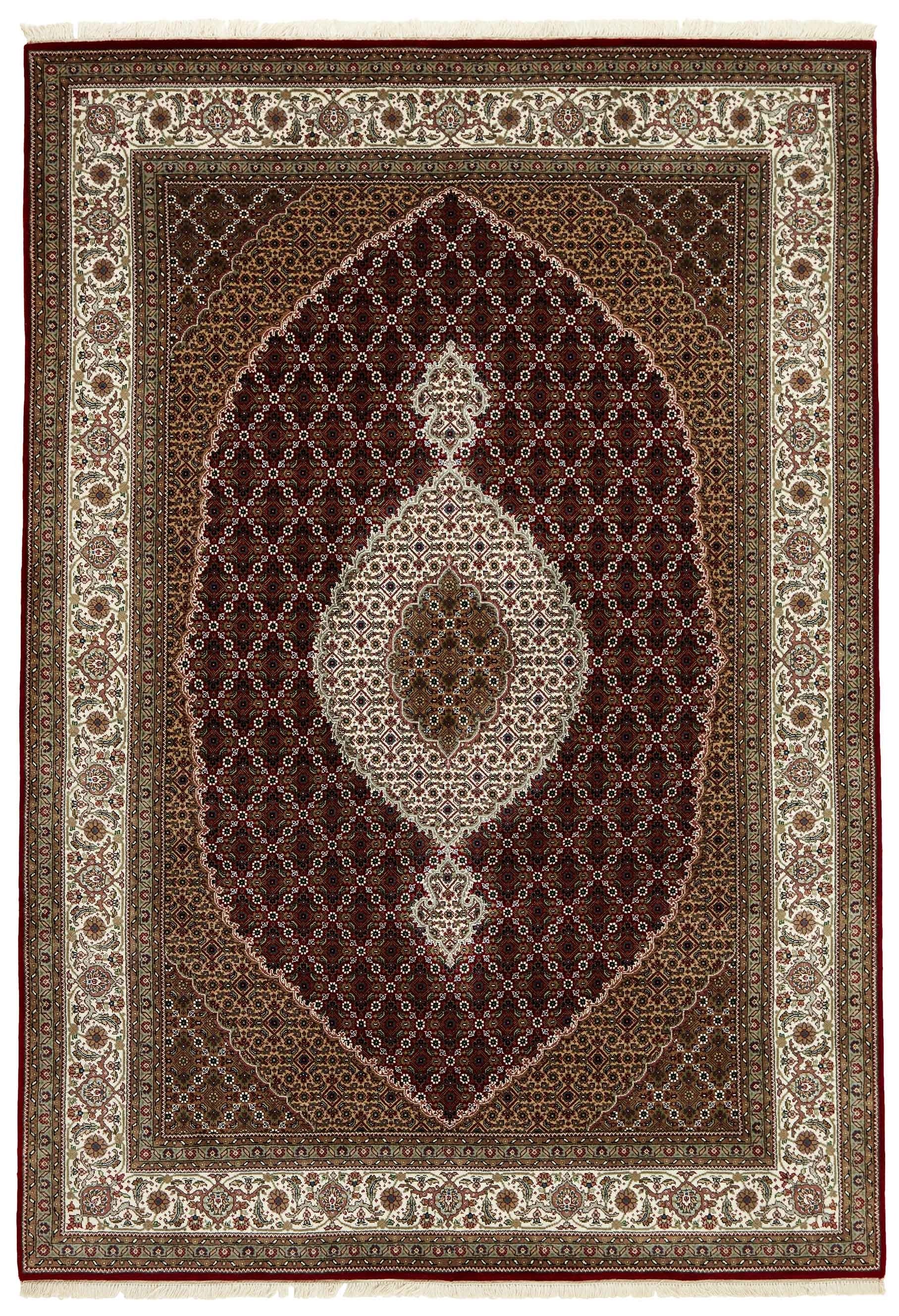 Authentic Oriental rug with traditional geometric and floral design in red, blue, green, beige, brown and black