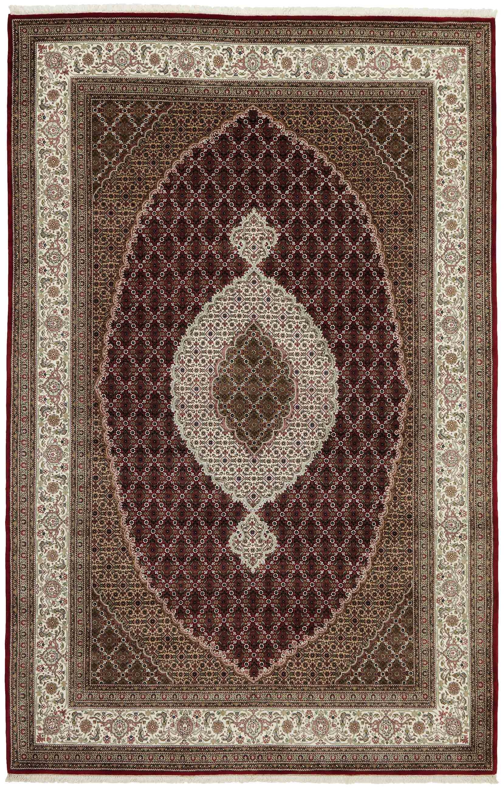 Authentic Oriental rug with traditional geometric and floral design in red, blue, green, beige, brown and black