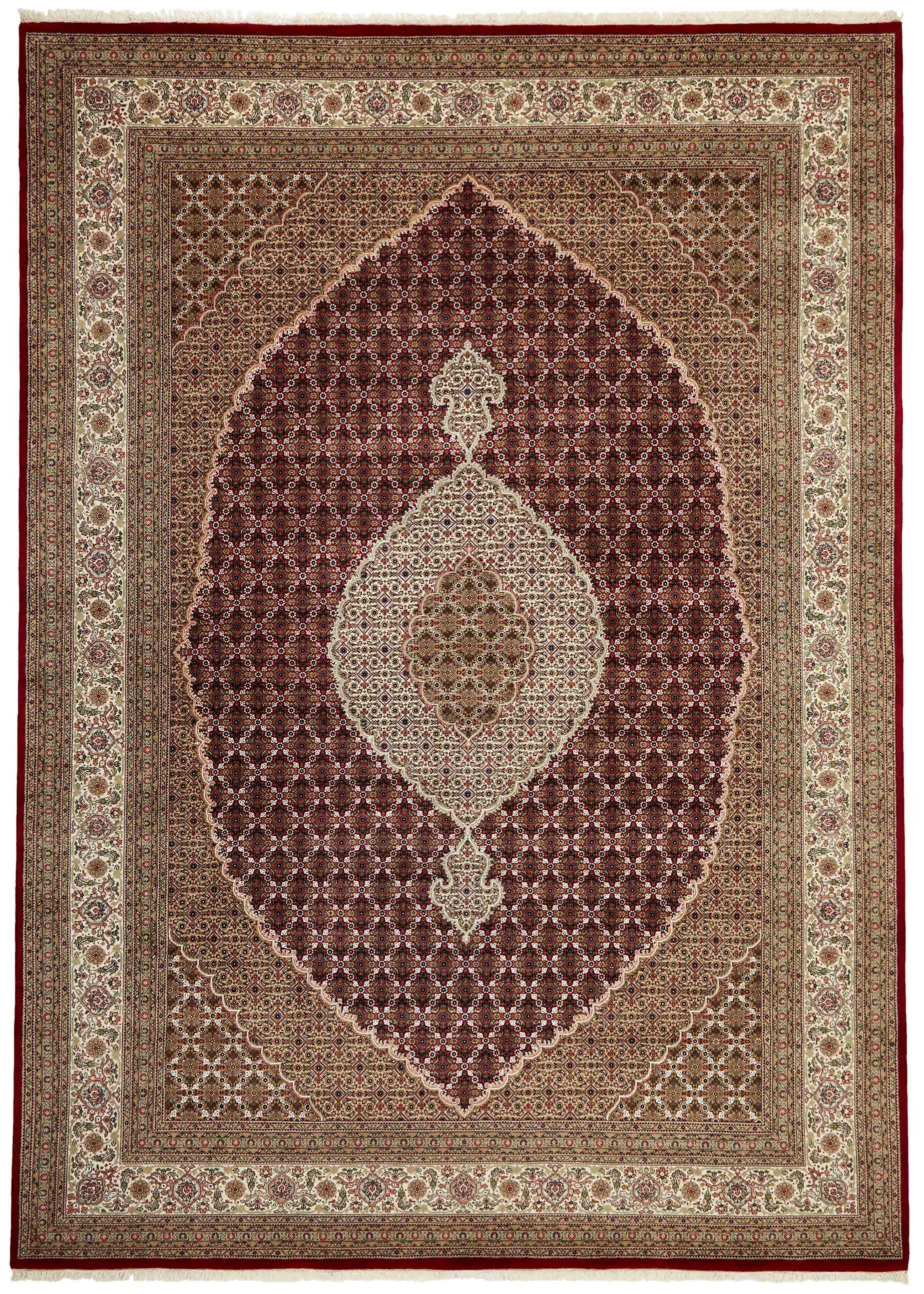 Authentic Oriental rug with traditional geometric and floral design in red, blue, green, beige, brown and black