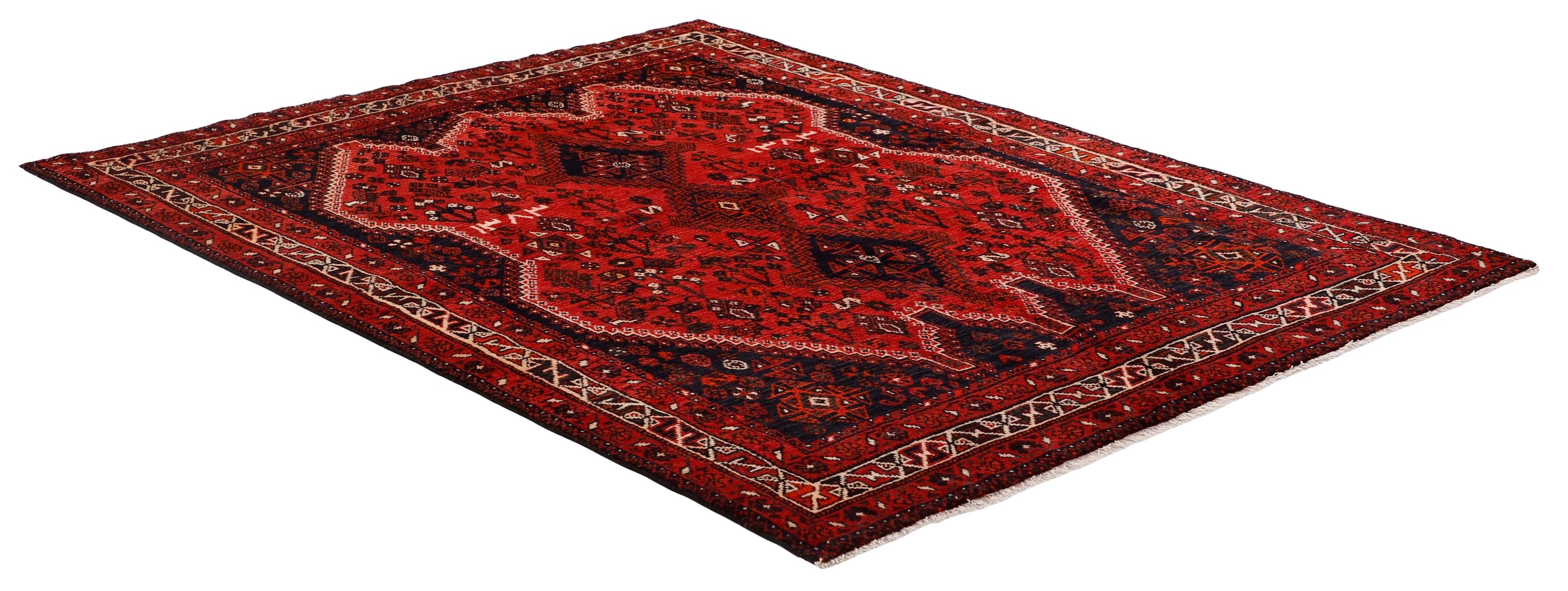 Authentic persian rug with a traditional tribal geometric pattern in red