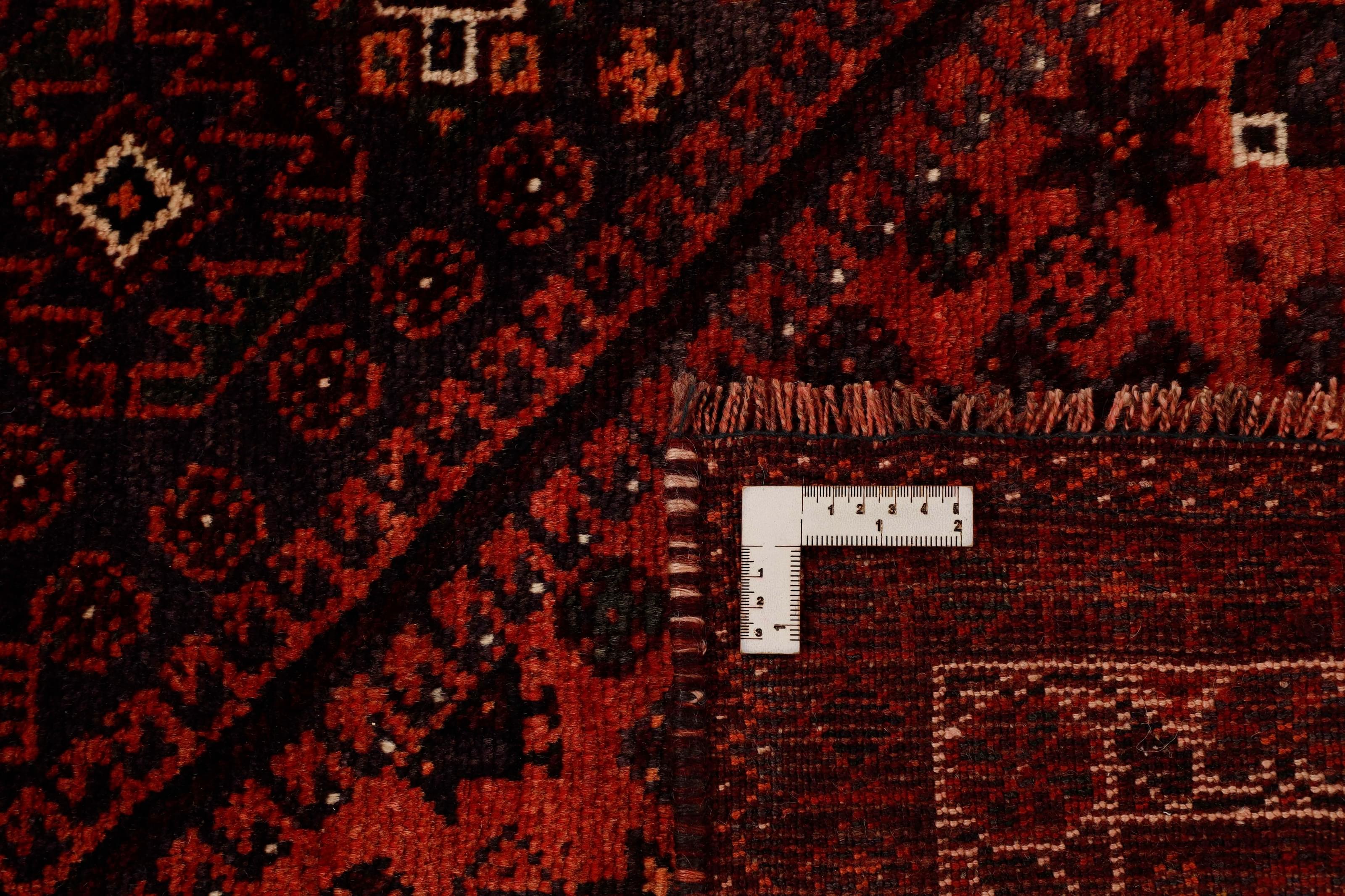 Authentic persian rug with a traditional tribal geometric pattern in red
