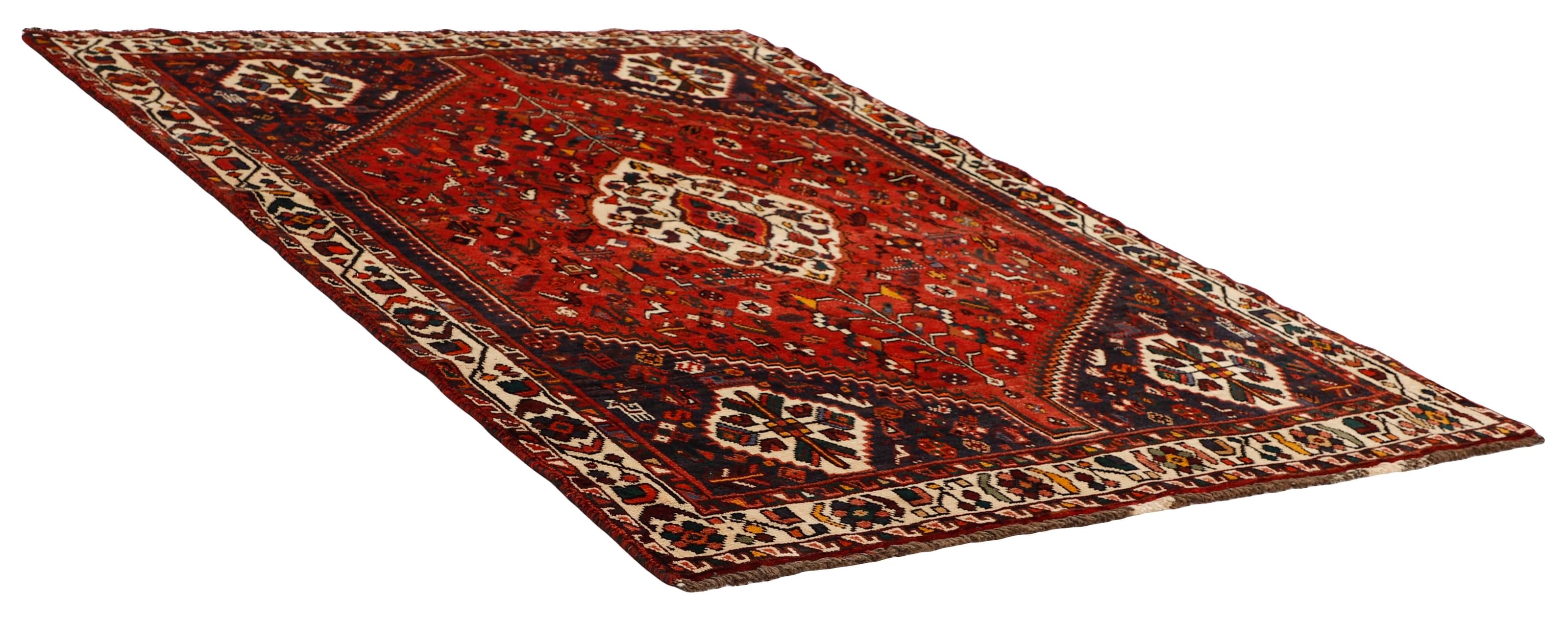 Authentic persian rug with a traditional tribal geometric pattern in red