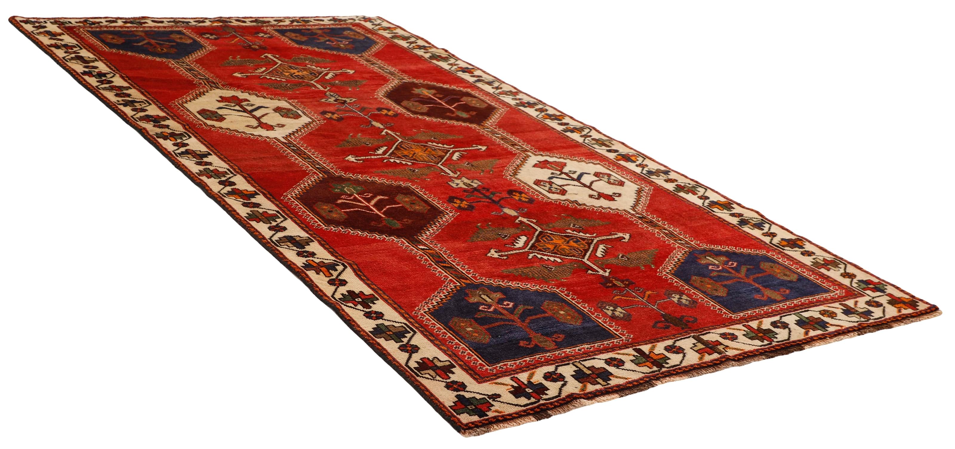 Authentic persian rug with a traditional tribal geometric pattern in red