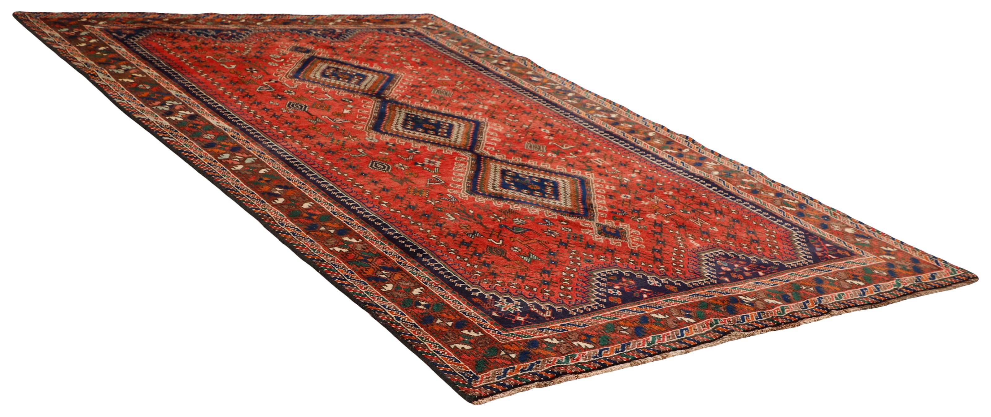 Authentic persian rug with a traditional tribal geometric pattern in red