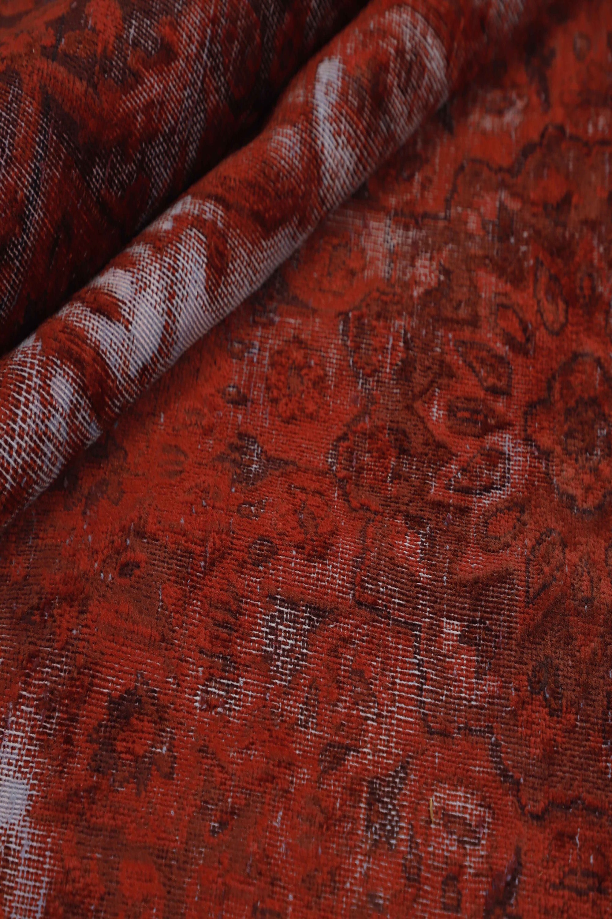 Red distressed bordered vintage Persian-style rug