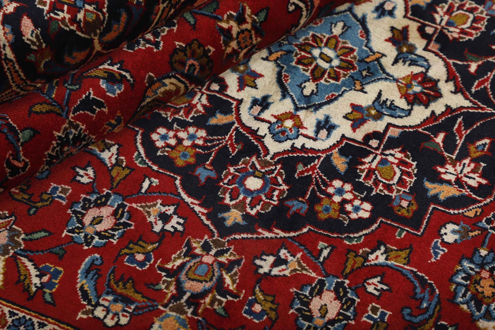 authentic persian rug with traditional floral design in red