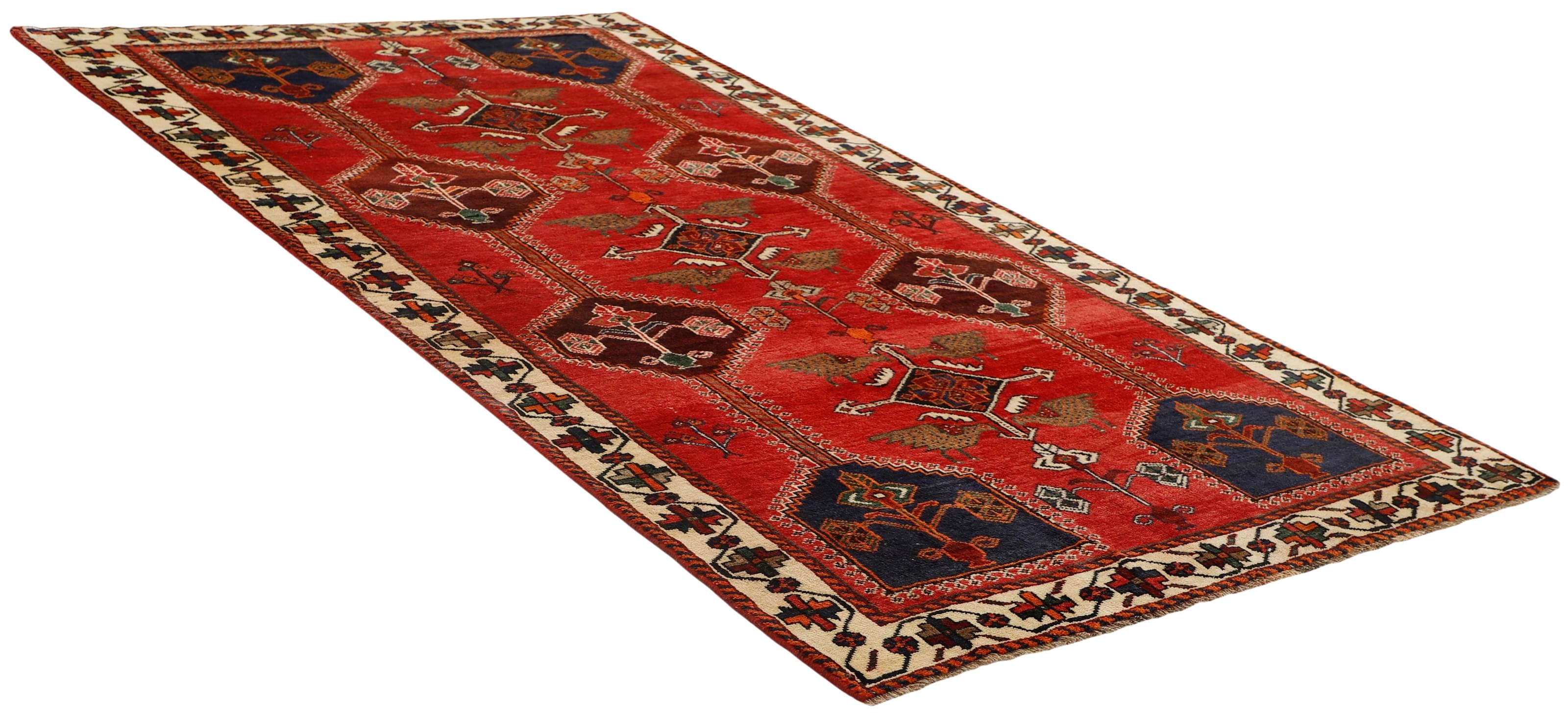 Authentic persian rug with a traditional tribal geometric pattern in red