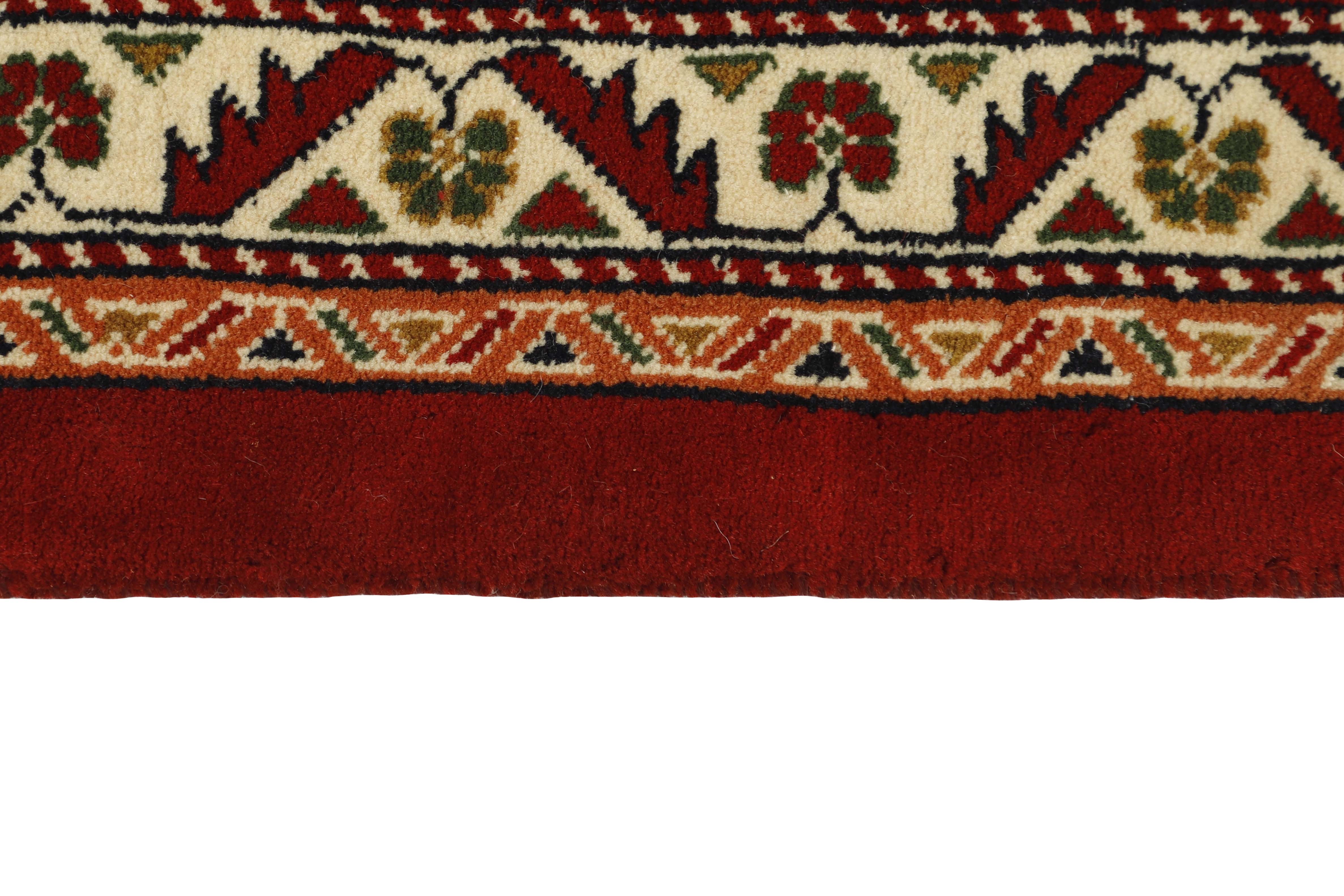Red Persian rug with tribal geometric design