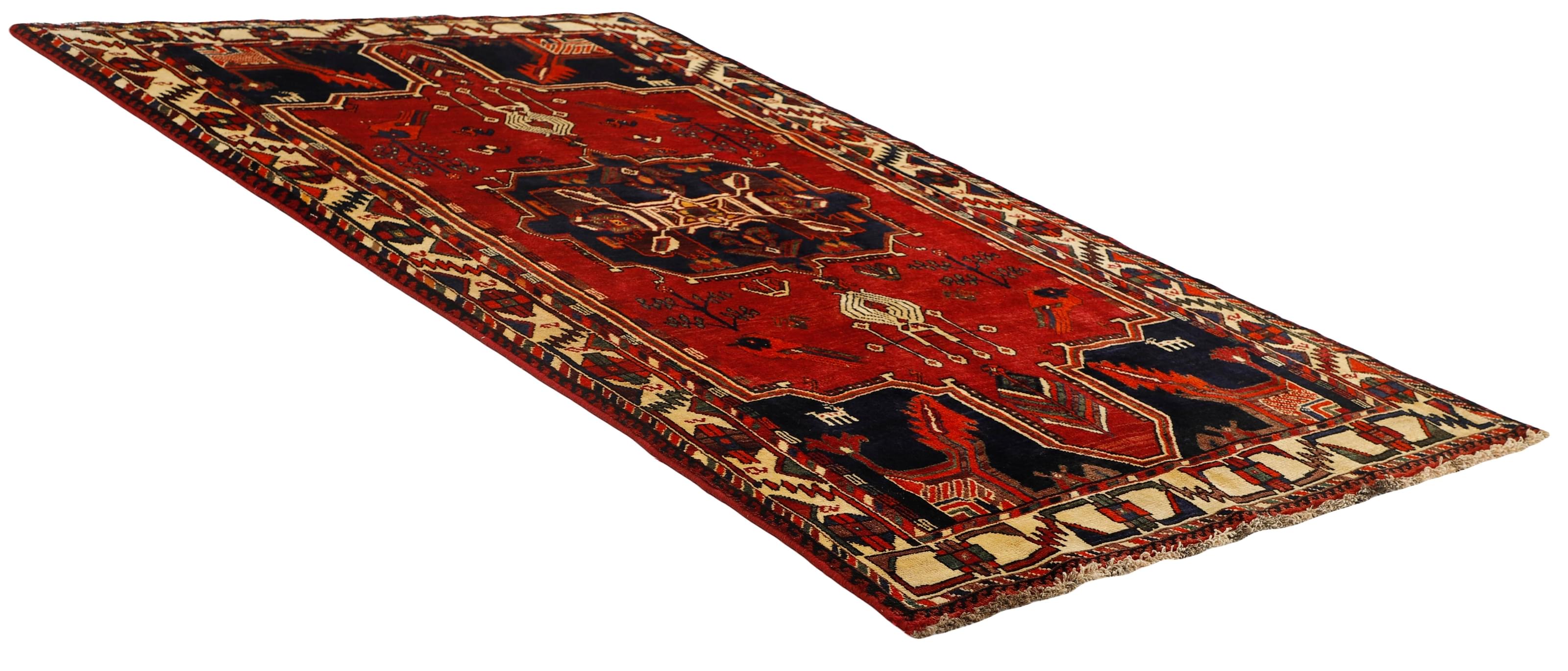 Authentic persian rug with a traditional tribal geometric pattern in red