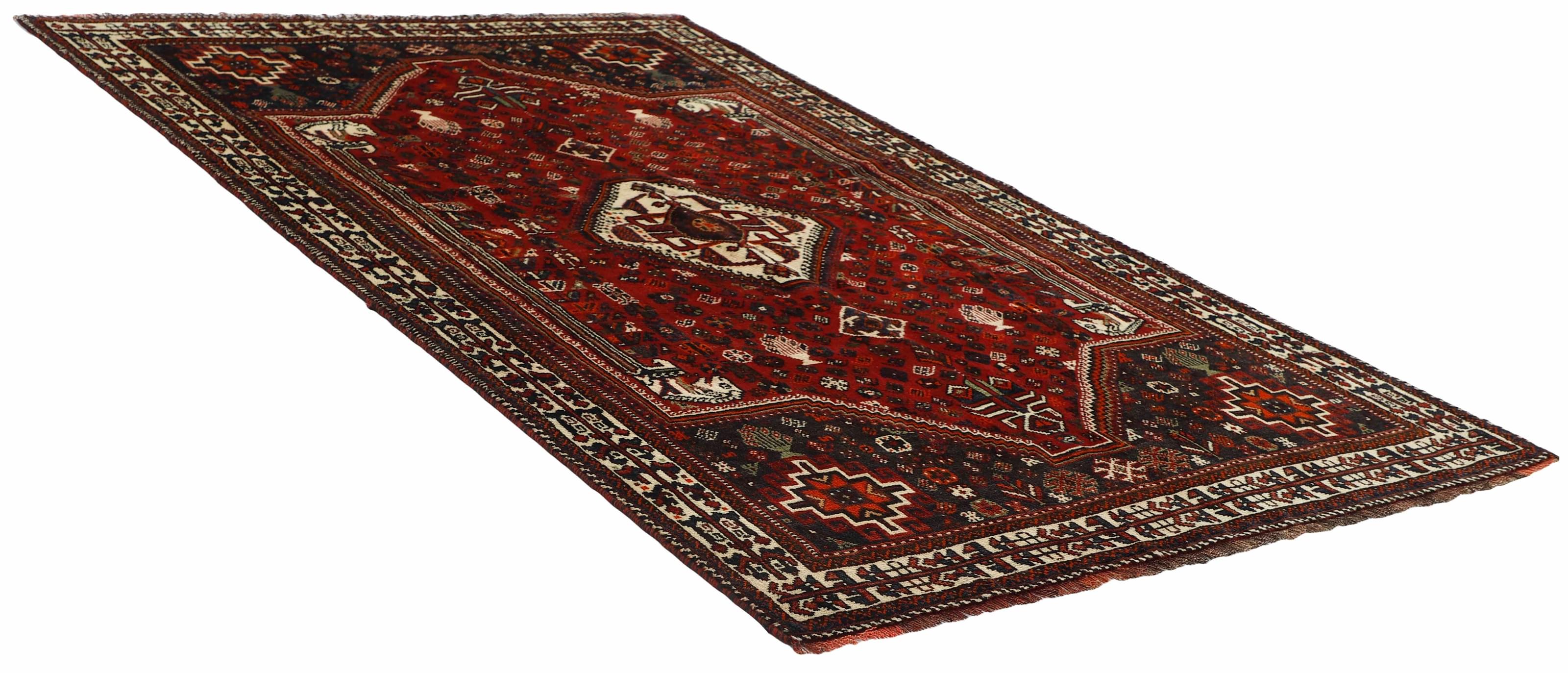 Authentic persian rug with a traditional tribal geometric pattern in red